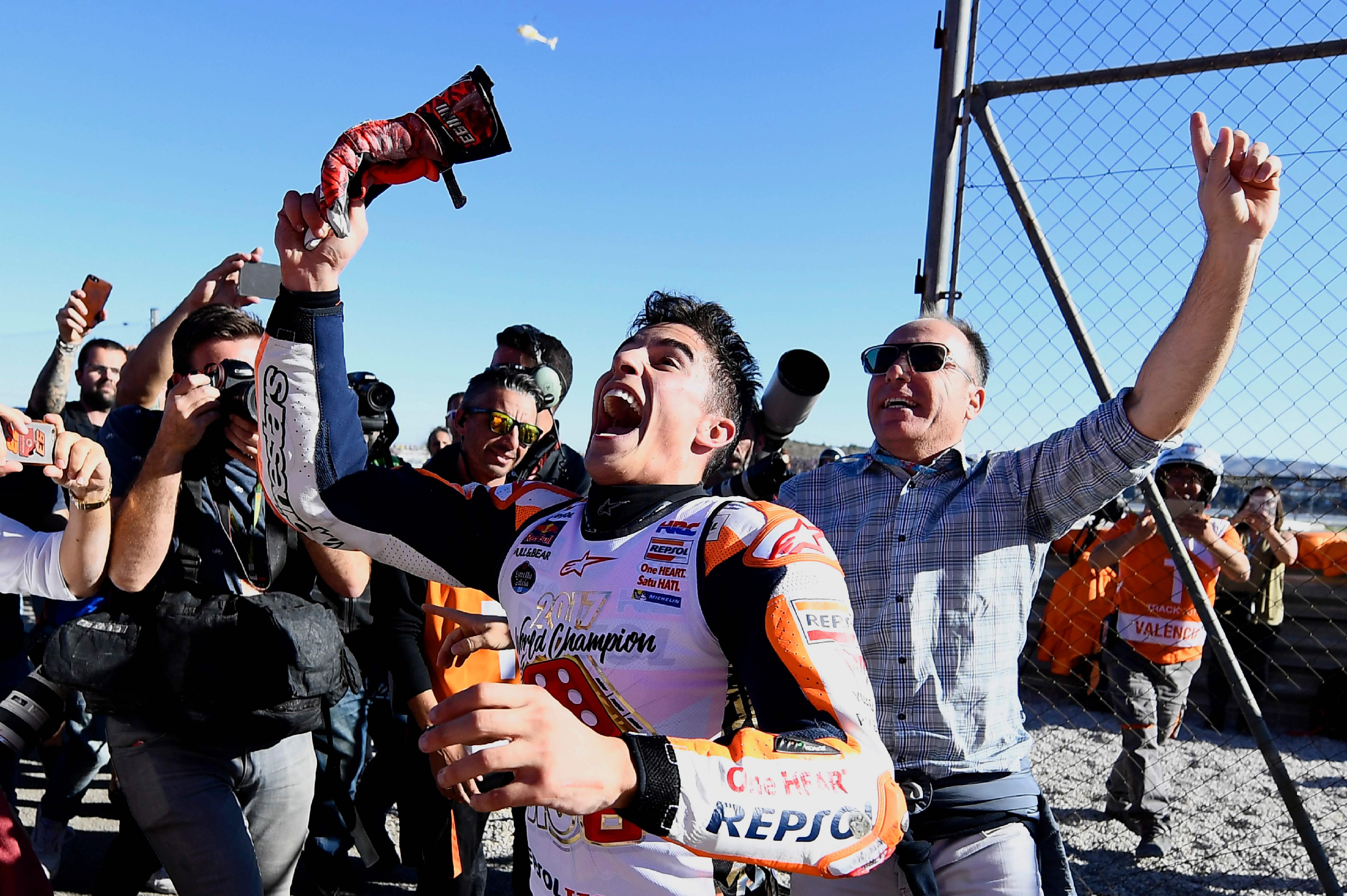 Spanish rider Marc Marquez celebrates after the MotoGP race of the Valencia Grand Prix. Photo: AFP
