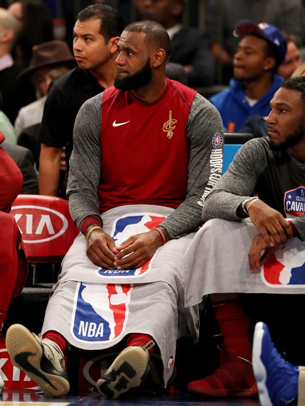LeBron James sits on the bench against the New York Knicks at Madison Square Garden. Photo: AFP