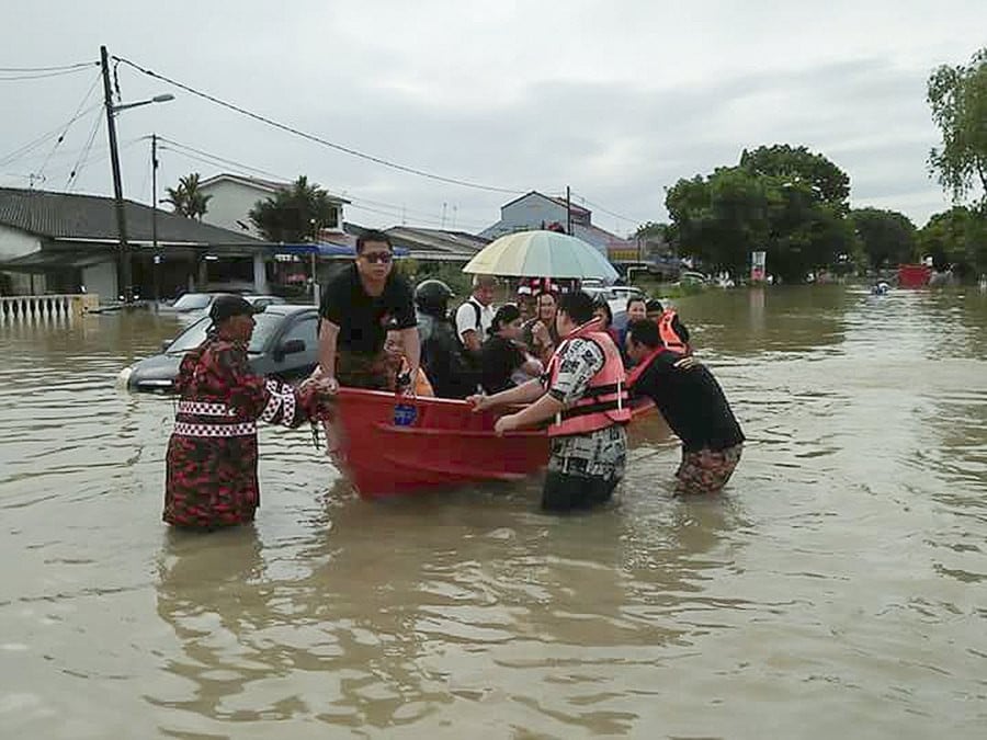 Flood victims in Georgetown, Penang. Photo: EPA