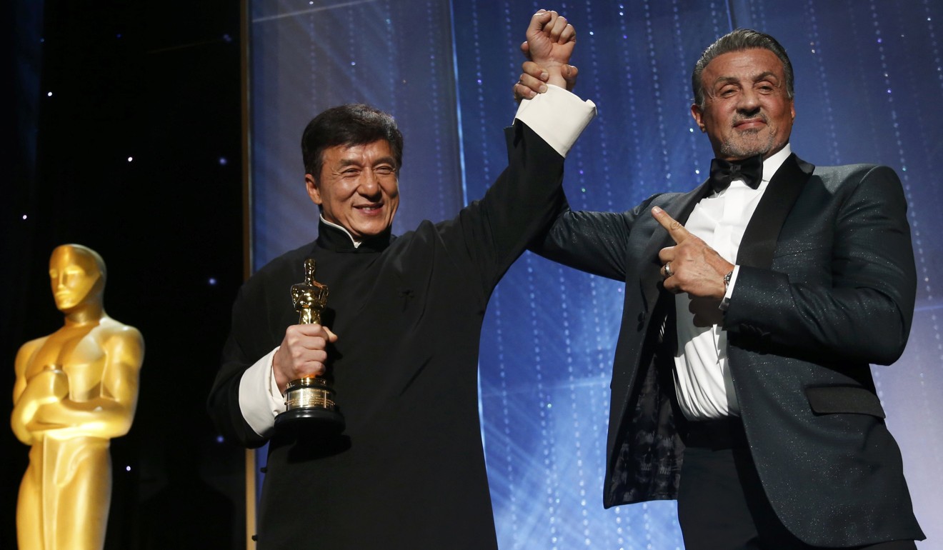 Actor Jackie Chan is congratulated by fellow actor Sylvester Stallone (R) after accepting his Honorary Award at the 8th Annual Governors Awards in Los Angeles, California. Photo: Reuters