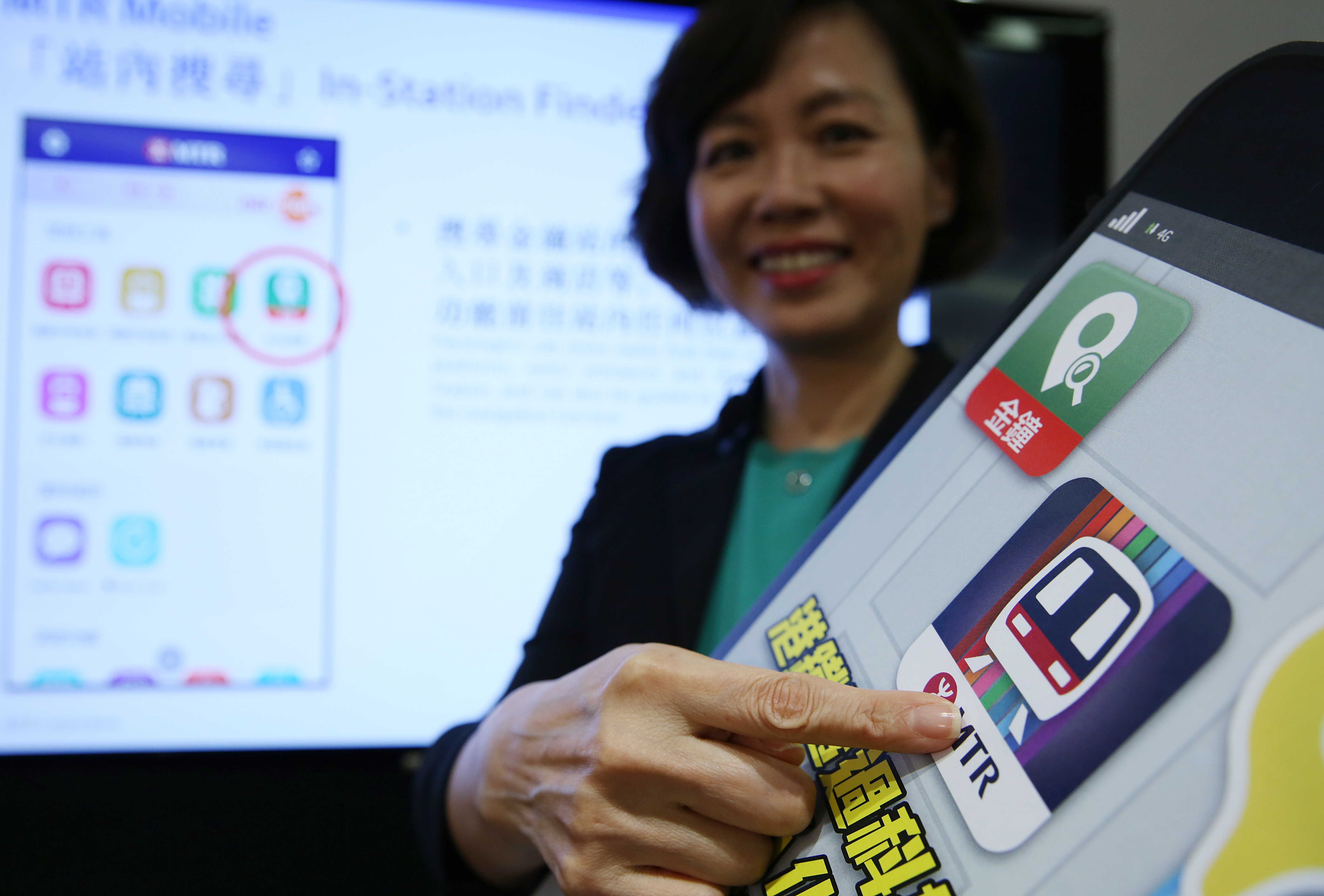 Jeny Yeung, commercial director of Hong Kong’s MTR Corporation, demonstrates the new MTR mobile app at a press conference in Kowloon Bay in August. Photo: Sam Tsang