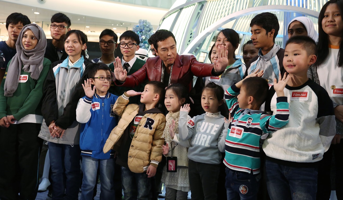 ChickenSoup Foundation treated 300 underprivileged children the premiere of Rogue One: A Star Wars Story with actor Donnie Yen (centre). Photo: Jonathan Wong