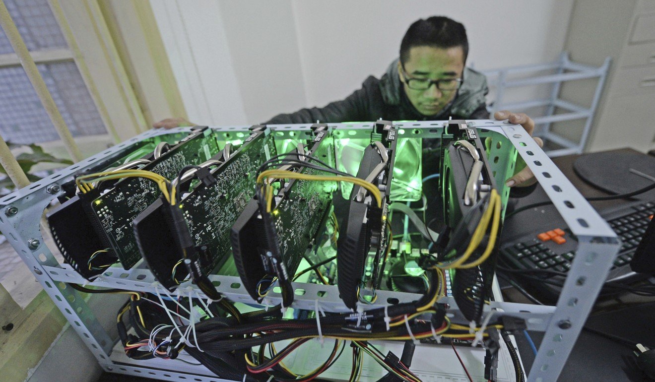 A technician checks a bitcoin mining computer at a mining company called Landminers in southwestern China's Chongqing municipality. Photo: AP