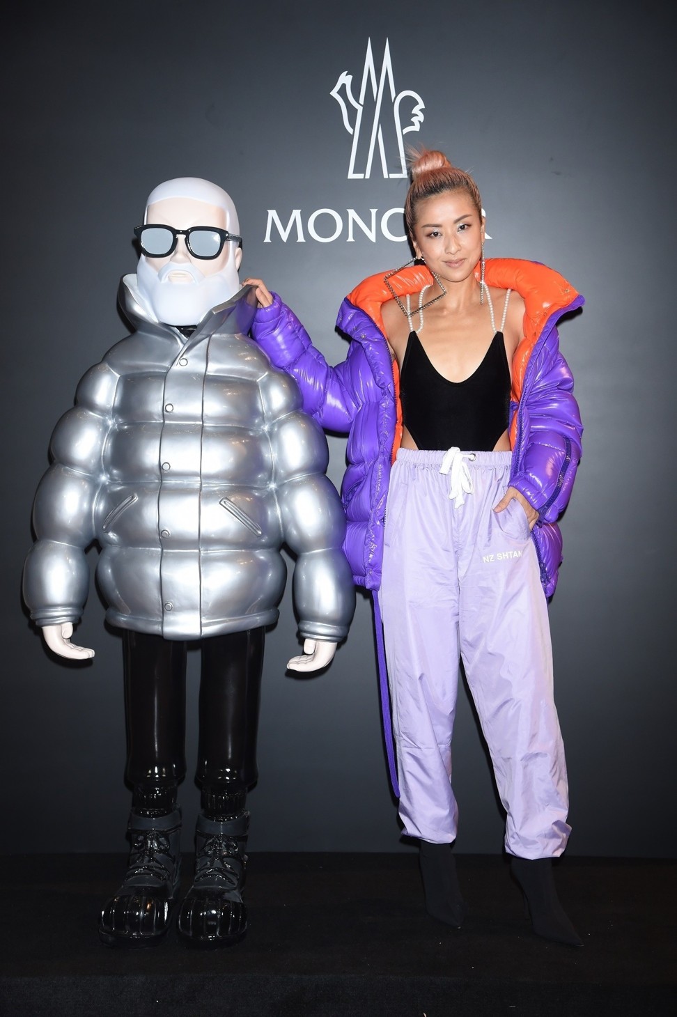 Tsui with a large version of a Mr Moncler figurine at the new store’s opening.