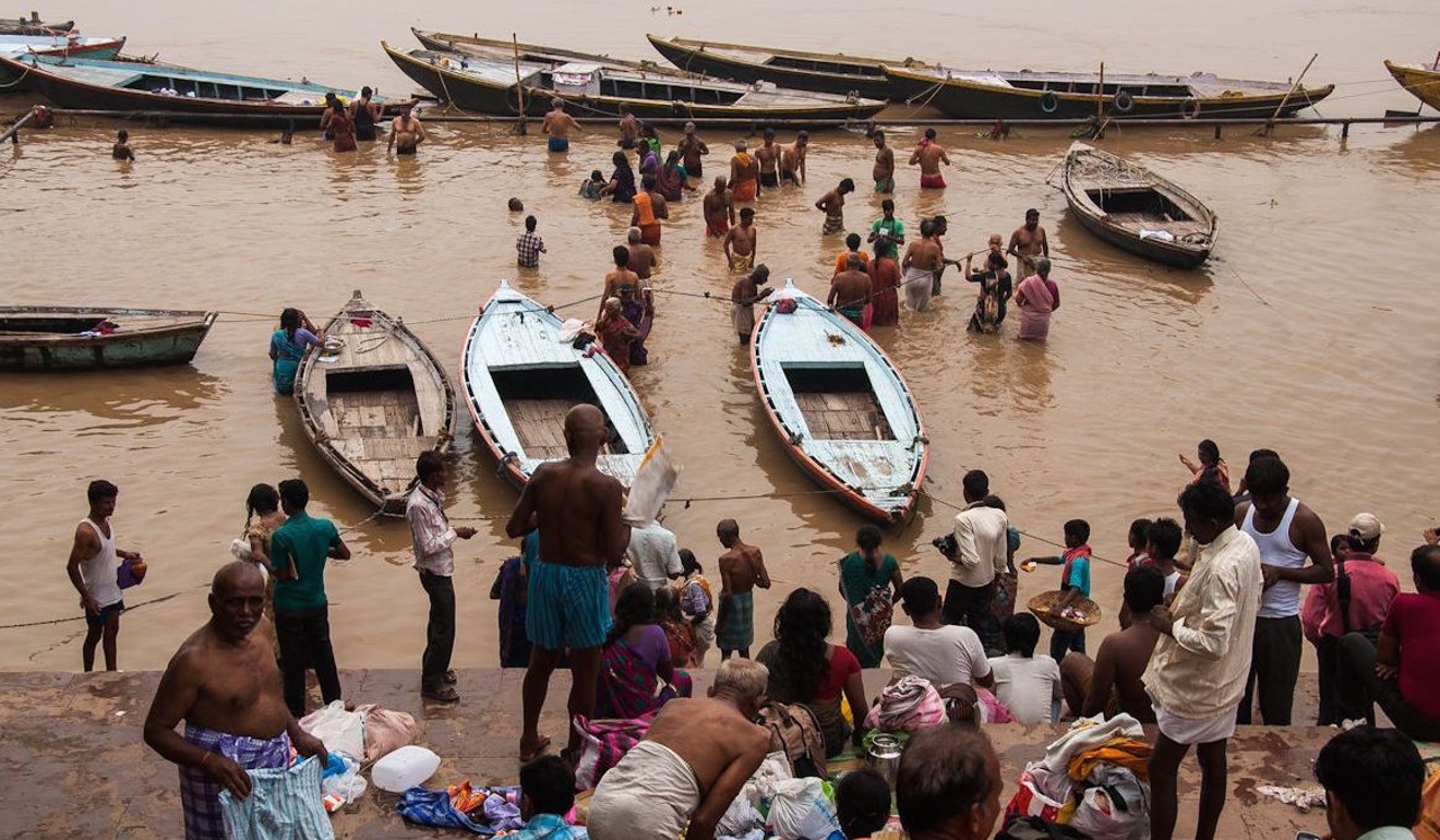 Hindu devotees in the Ganges, Varanasi, India. Photo: Juno Kim