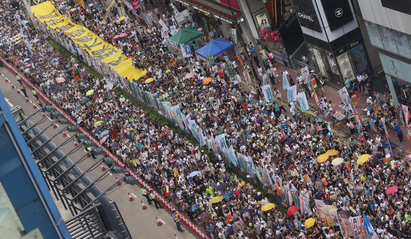 Groups opposed to the East Lantau Metropolis plan march in the July 1 rally last year. Photo: K.Y. Cheng