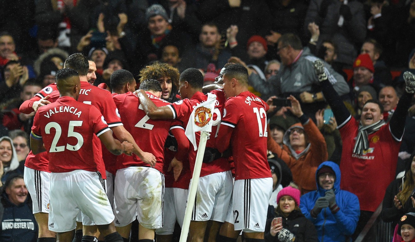 Manchester United celebrate after Ashley Young's shot deflects in against Brighton. Photo: AFP