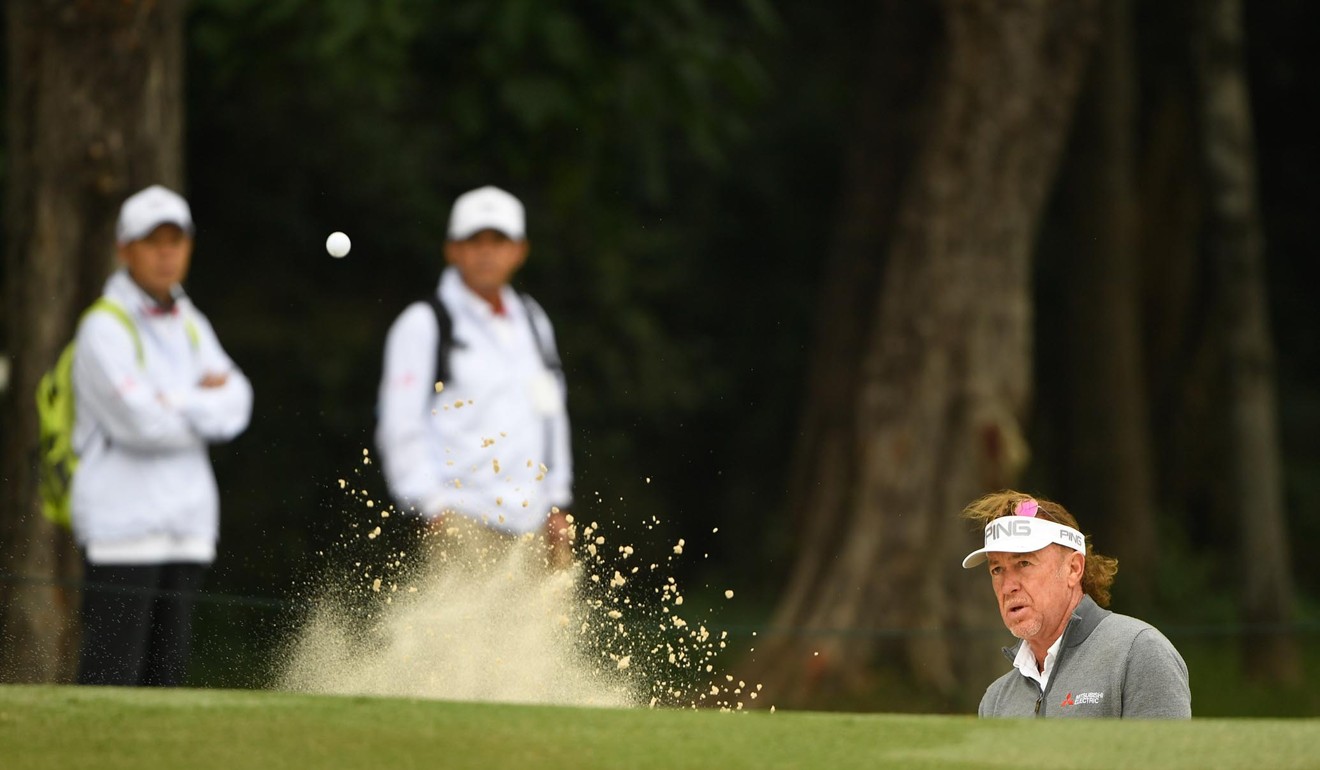 Miguel Angel Jimenez negotiates his way out of a bunker during the Hong Kong Open.