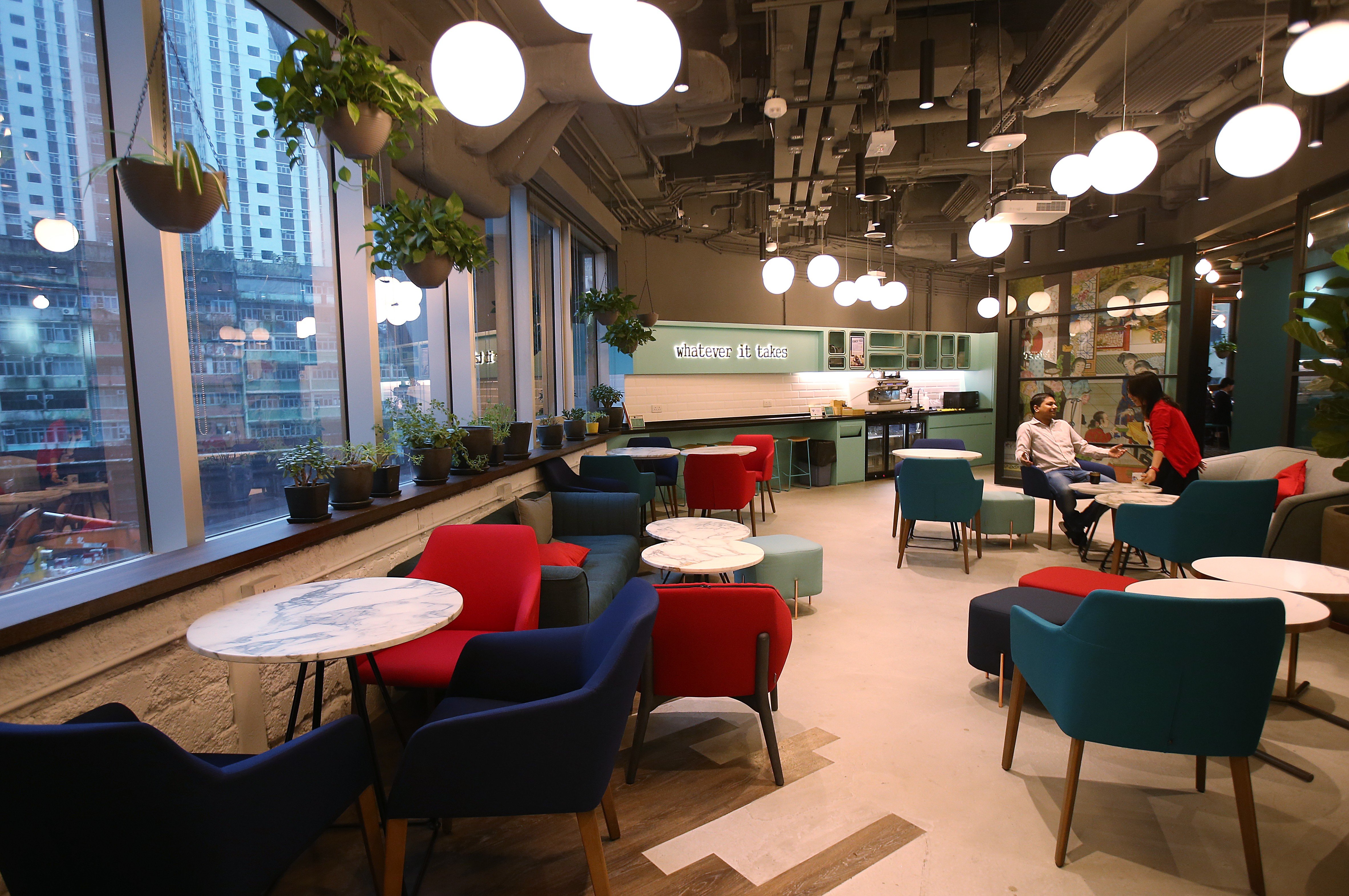 Multinational companies are beginning to discover the appeal of co-working spaces as a flexible office solution
