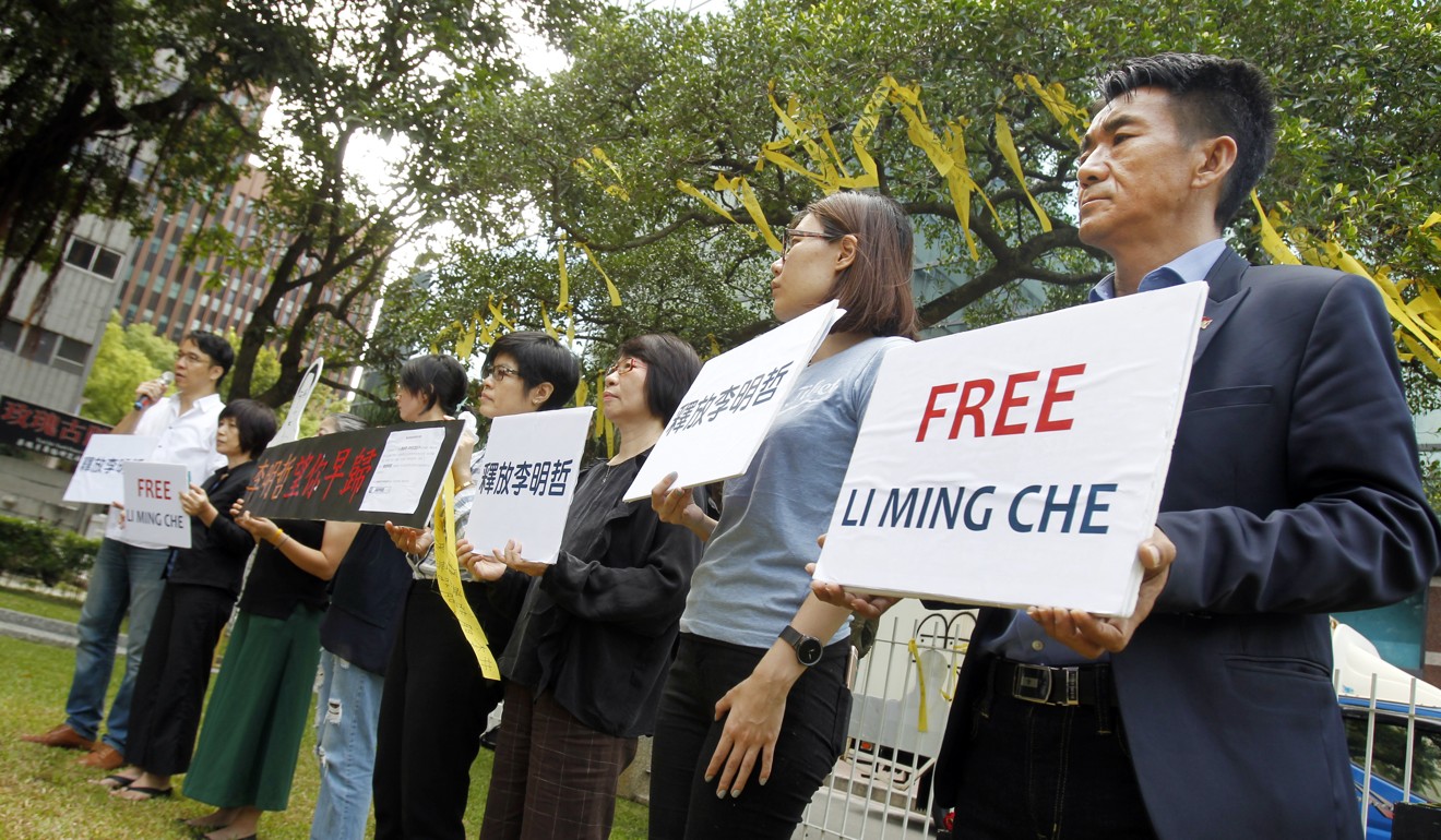 Supporters of activist Lee Ming-cheh hold a protest in Taipei earlier this month calling for his release. Photo: AP