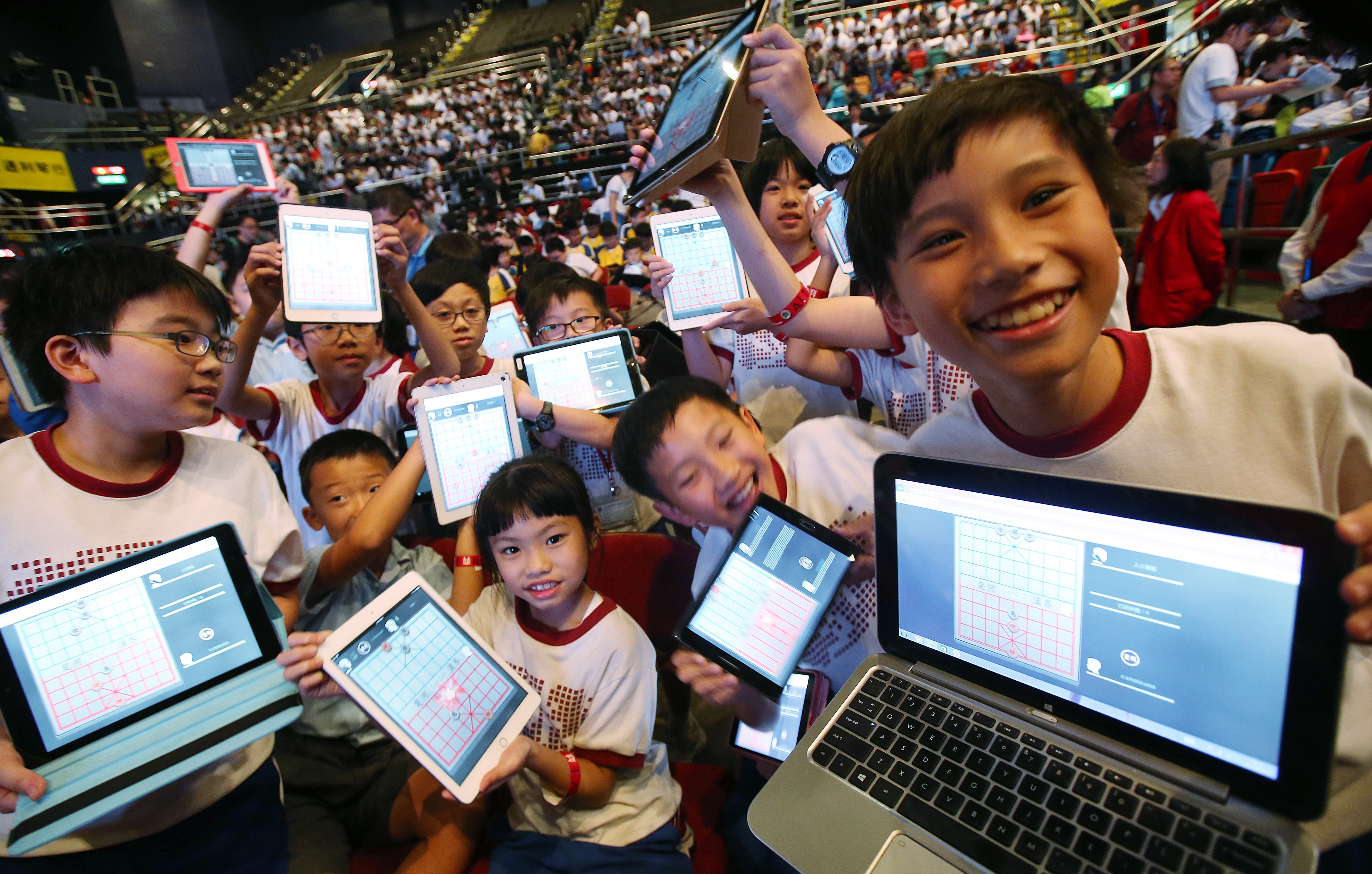 Students attend the Chinese Chess Challenge “1K vs AI” Battle Day at Queen Elizabeth Stadium in Wan Chai, where 1,000 students played against Chinese chess artificial intelligence systems on October 27. Photo: David Wong