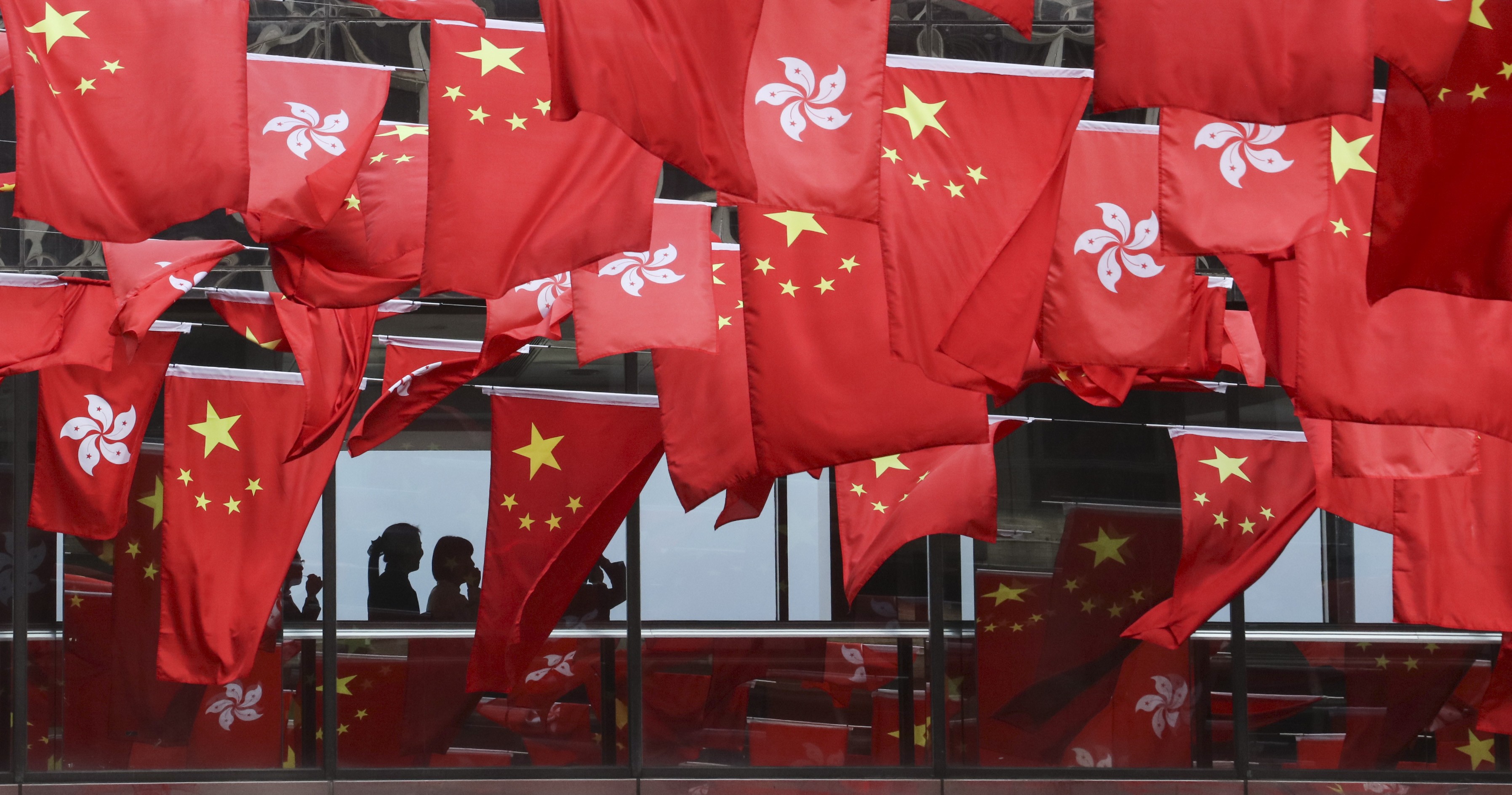 Hong Kong SAR and Chinese national flags set up in rows around East Tsim Sha Tsui mark the 20th anniversary of the handover, on June 26. Photo: Felix Wong
