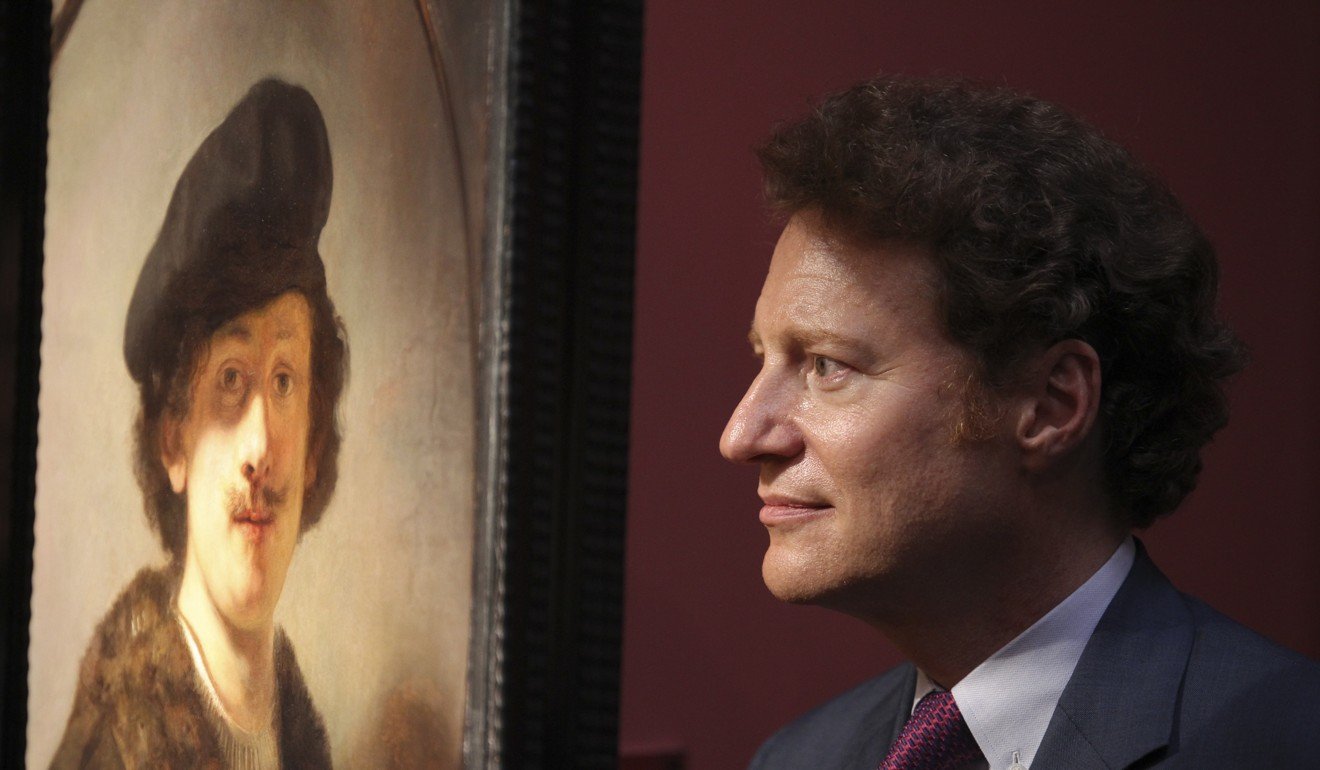 Kaplan with Rembrandt’s Self-portrait with Shaded Eyes, at the Long Museum. Picture: Simon Song