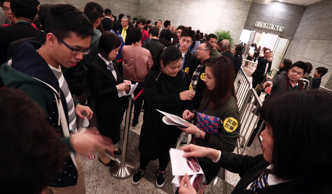 Prospective home buyers line up earlier this month at Sun Hung Kai Properties' Cullinan West II development at the International Commerce Centre in West Kowloon. Photo: Jonathan Wong