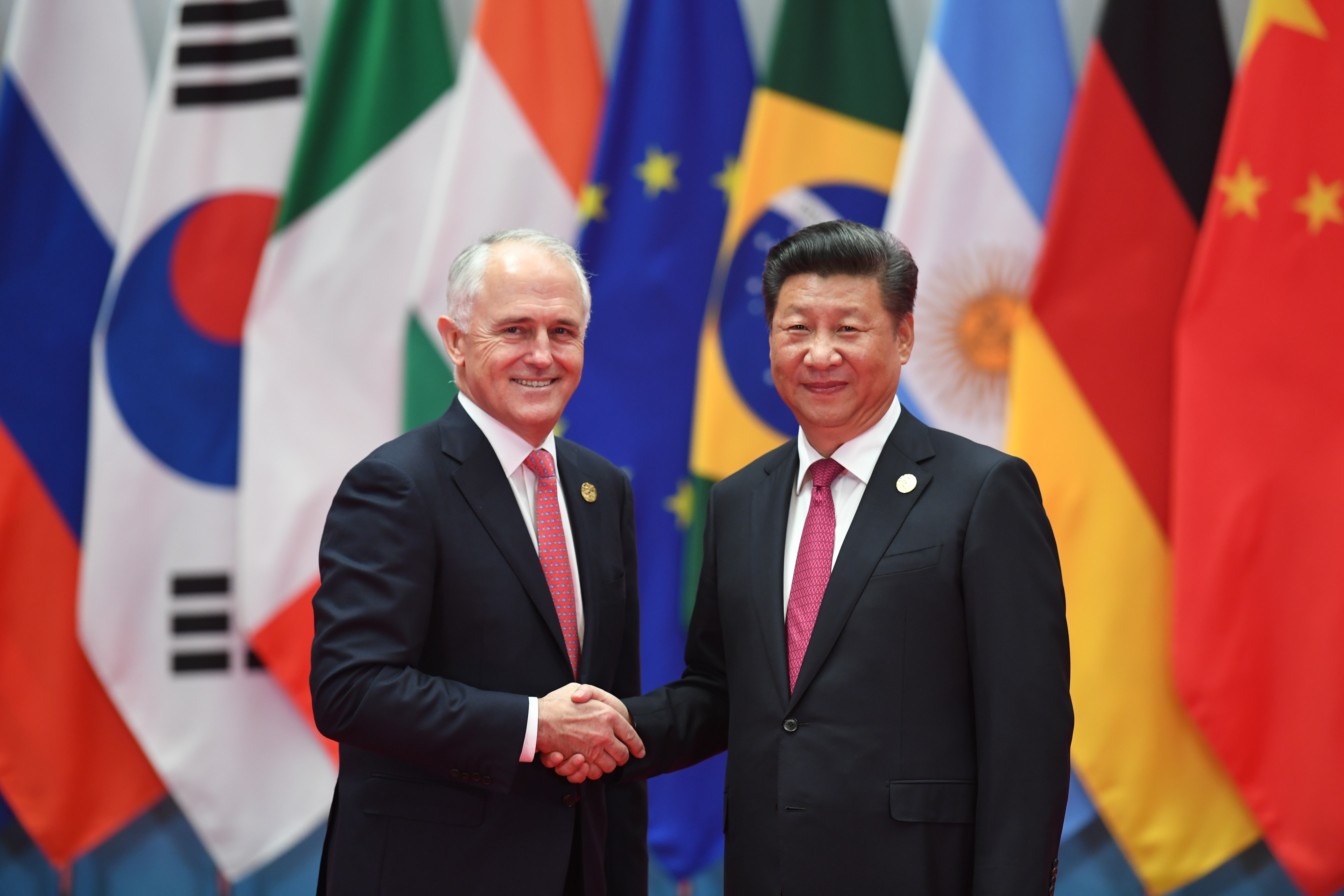 Australia's Prime Minister Malcolm Turnbull shakes hands with Chinese President Xi Jinping before the G20 leaders' family photo in Hangzhou, on September 4, 2016. Photo: AFP