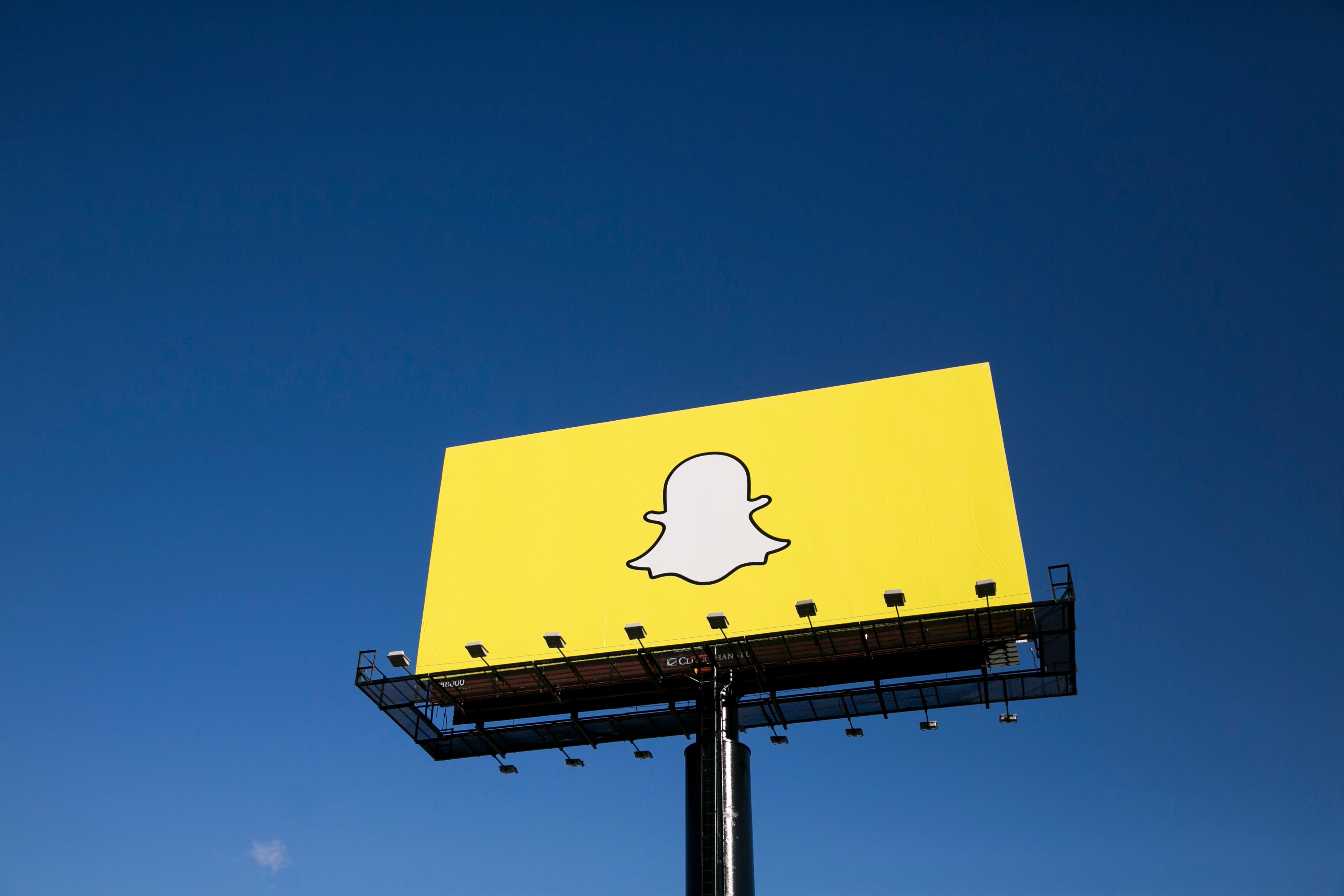 An advertising billboard featuring the Snapchat logo. The brand has undergone a complete redesign. Photo: Alamy