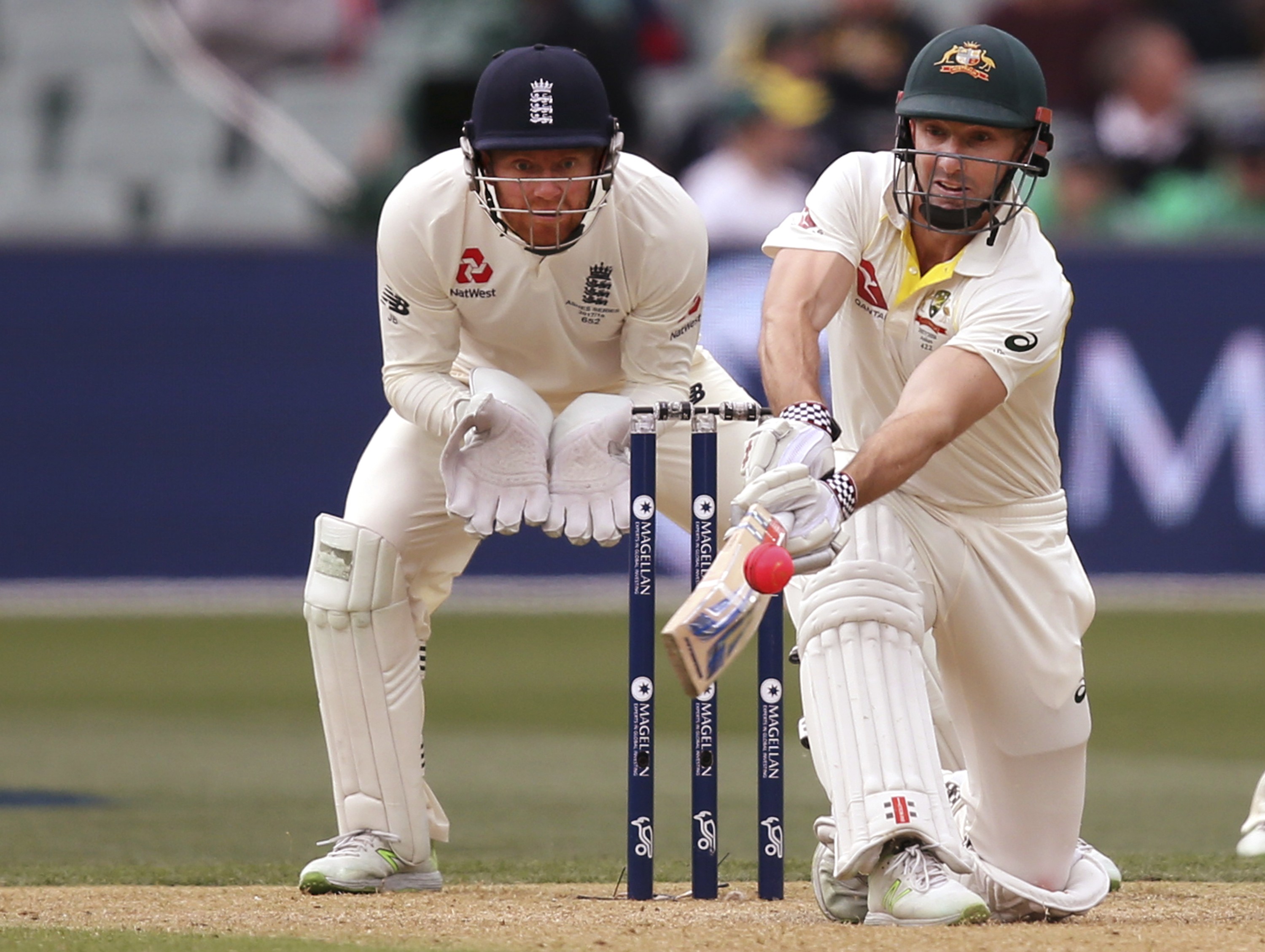 Australia’s Shuan Marsh attempts to sweep the ball in front of England’s Jonny Bairstow during the second day of the second Ashes test in Adelaide. Photo: AP