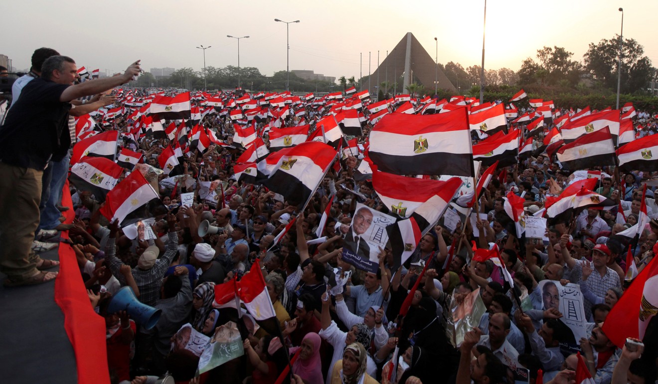 In this 2012 file photo, supporters of former prime minister Ahmed Shafik shout slogans against Mohammed Mursi of the now banned Muslim Brotherhood. Photo: Reuters