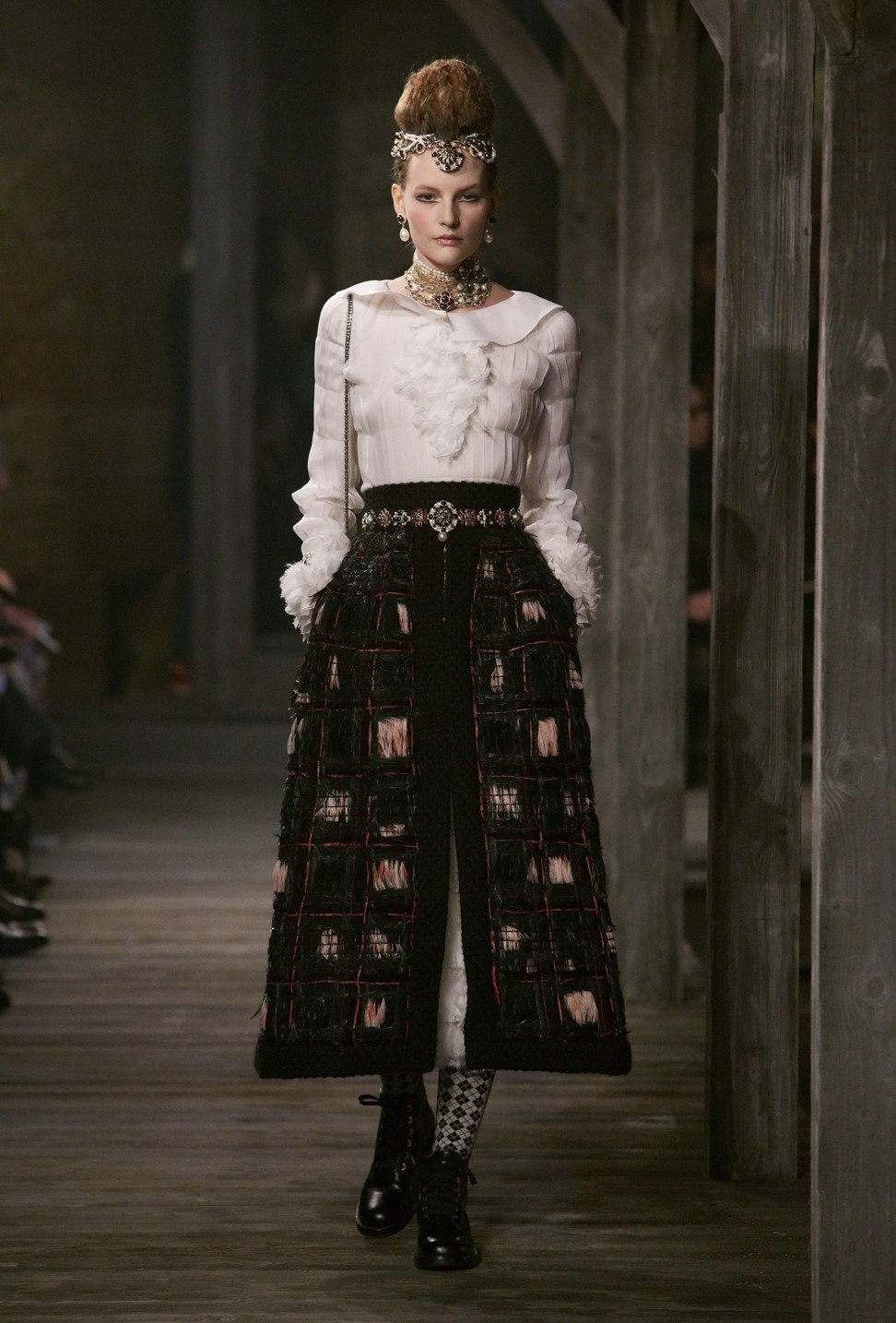 A model on the catwalk during Chanel's Metiers d'Art Paris-Édimbourg show 2013 at Linlithgow Palace in Scotland.
