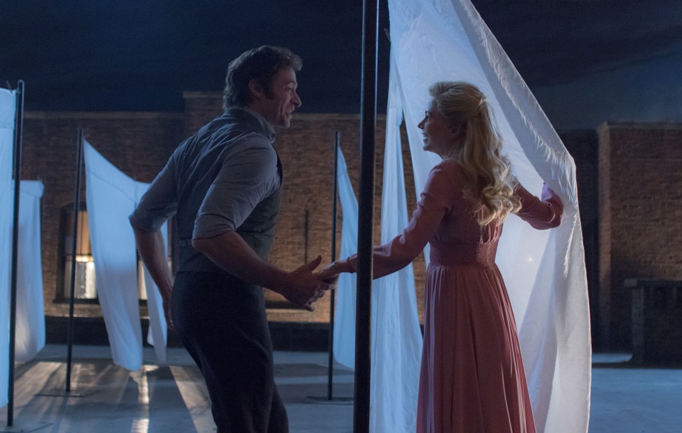 P.T. Barnum (Hugh Jackman) and Charity Barnum (Michelle Williams) share an enchanting dance on a New York rooftop in ‘The Greatest Showman’.
