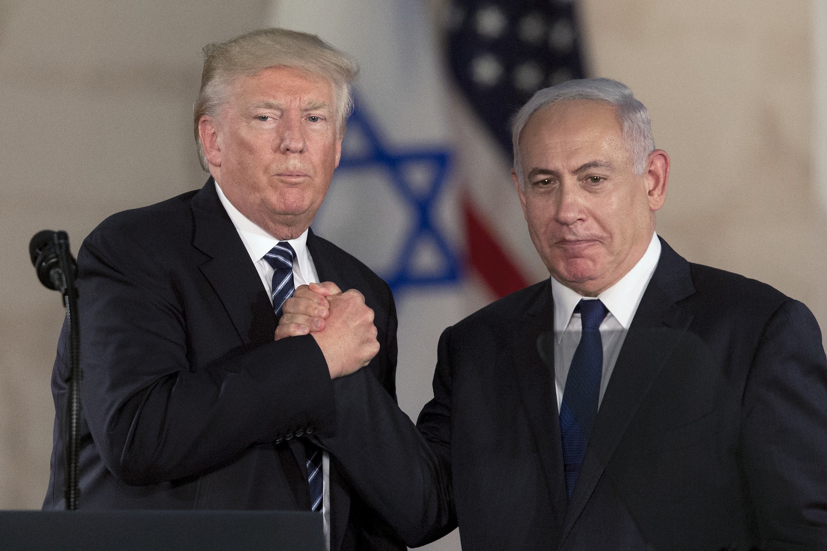 US President Donald Trump and Israeli Prime Minister Benjamin Netanyahu shake hands in Jerusalem in May. Photo: AP