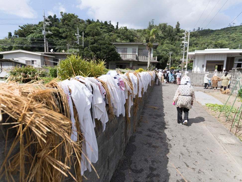 Wet costumes dry out after the Shioya Ungami festival (Sea God Festival) in Ogimi village. Photo: Alamy