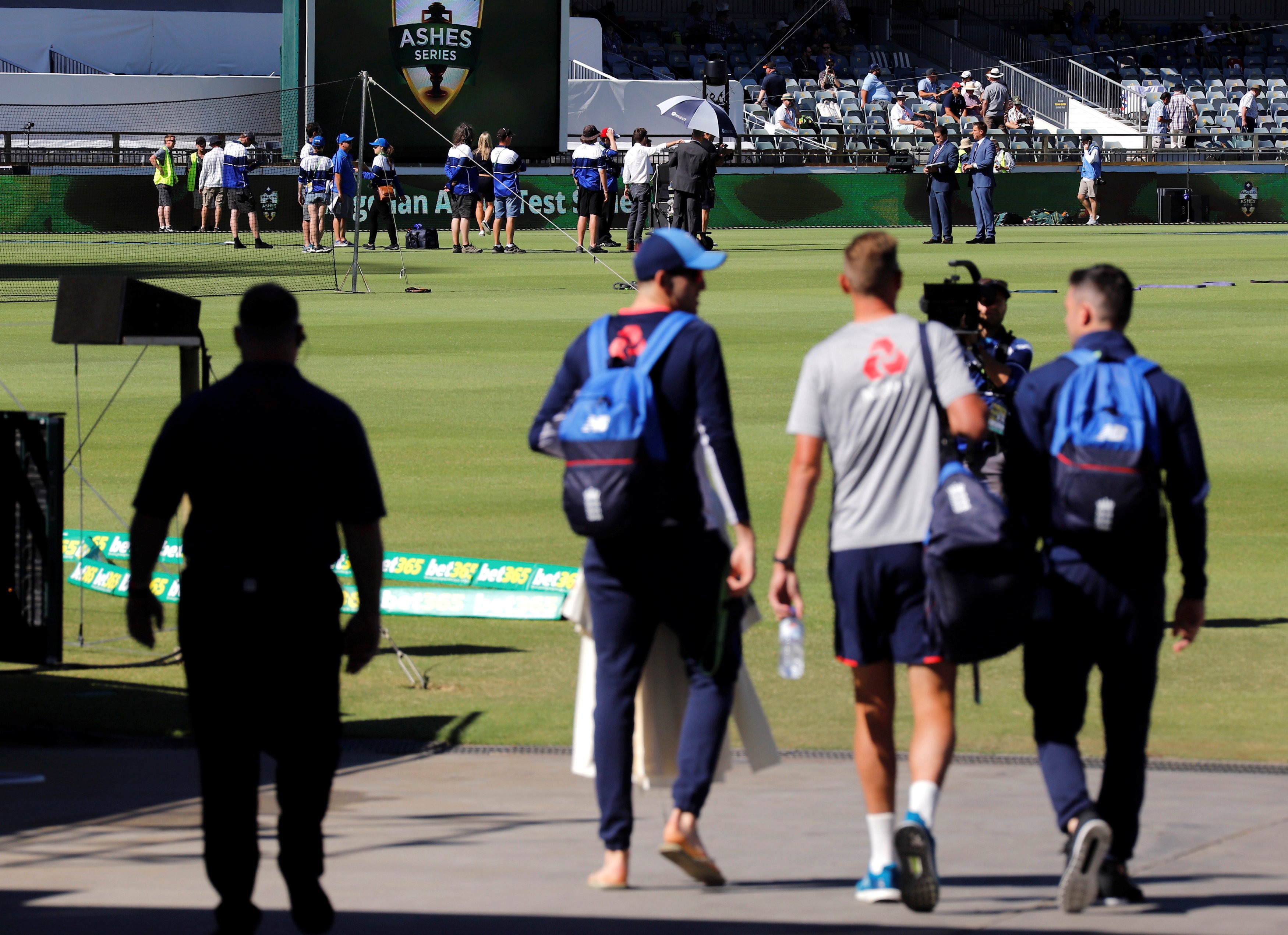 England players James Anderson and Stuart Broad walk out onto the WACA ahead of the third Ashes test against Australia. Photo: Reuters