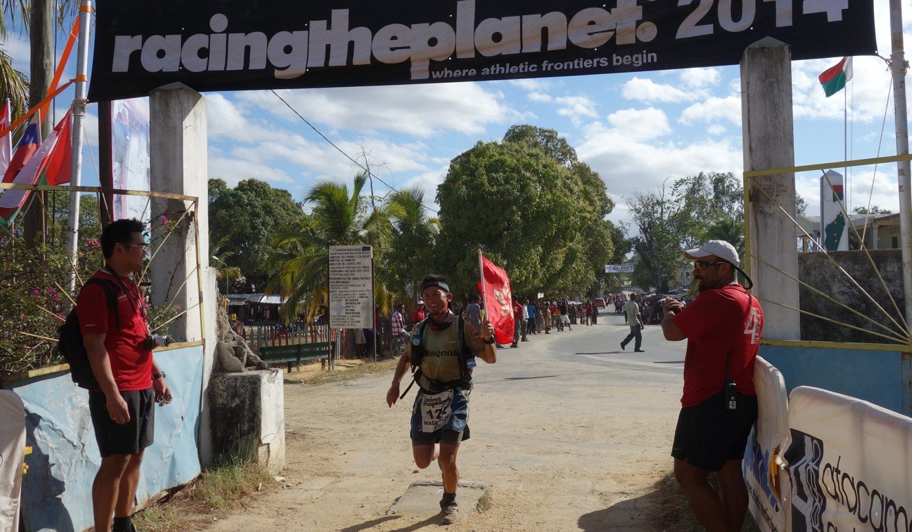 Kwik crosses the finish line of the 2014 Racing the Planet race in Madagascar.