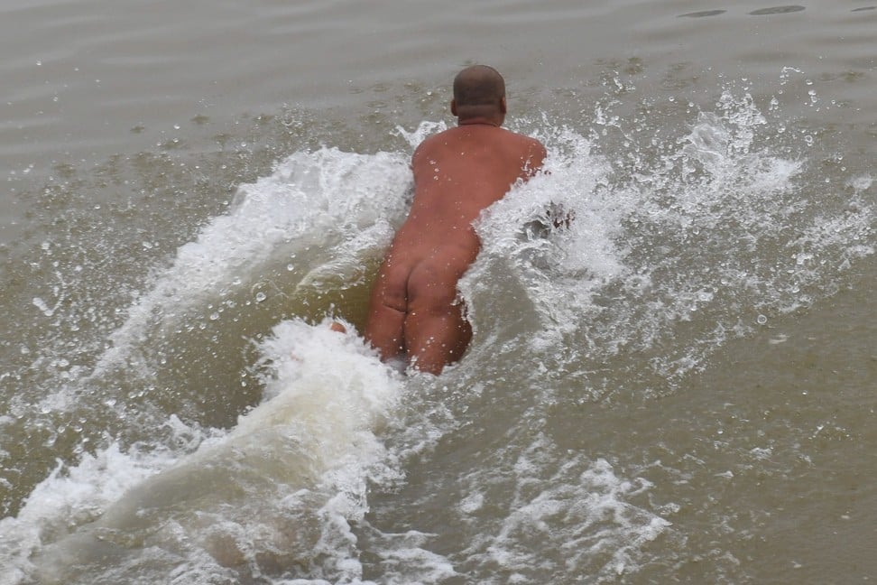 Nudists brush aside concerns that the Red River is not clean enough for swimming. Photo: AFP