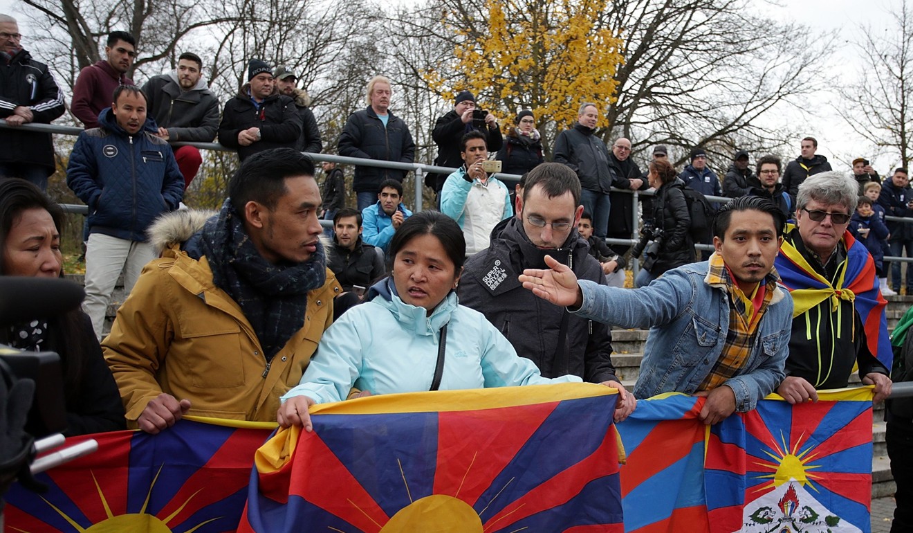 Protesters hold up Tibetan flags ahead of a friendly football match between TSV Schott Mainz vs China's under-20 team in Mainz, Germany, on November 18. Photo: AFP