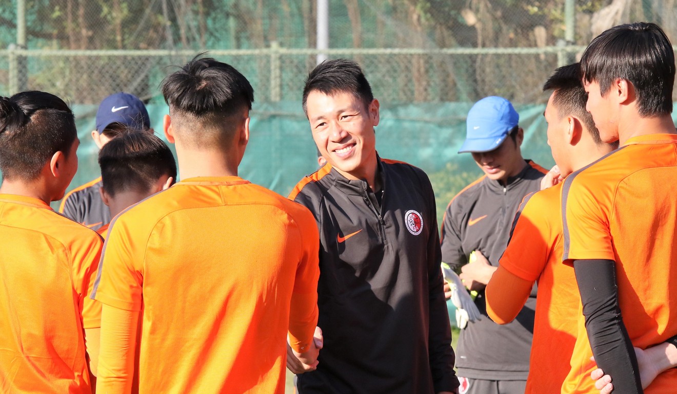 Hong Kong coach Kenneth Kwok meets his young charges.