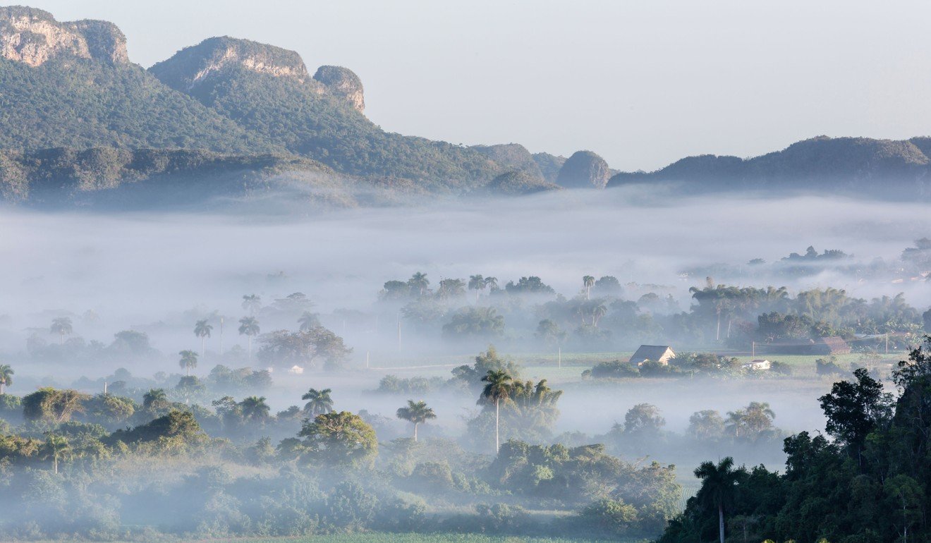 Fog rols over a rural valley in Vinales, Pinar del Rio. Cuba’s interior is well worth visiting. Picture: Alamy
