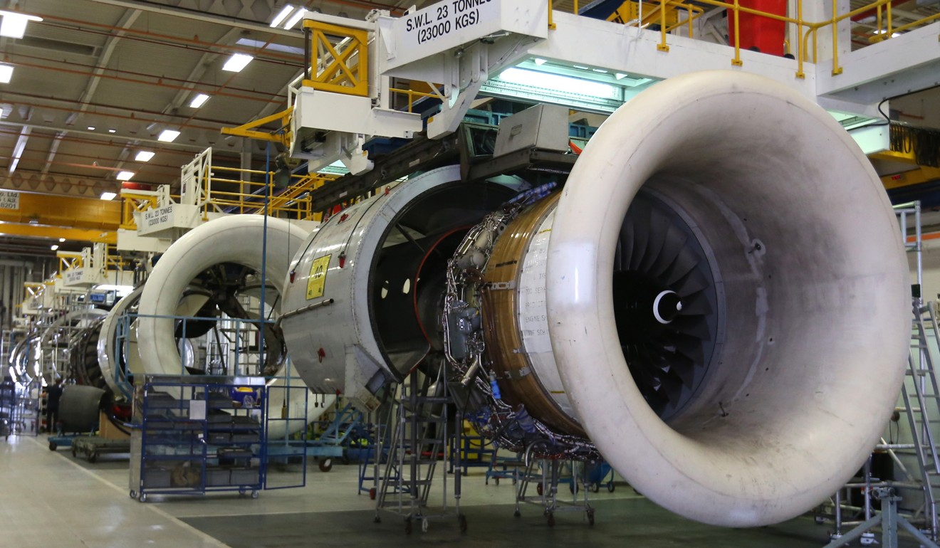 External casing for aircraft engines hang on the production line at the Rolls-Royce factory in Derby, UK. Rolls-Royce has plans for a £150 million aerospace plant in Derby amid optimistic signs for British manufacturing overall. Photo: Bloomberg