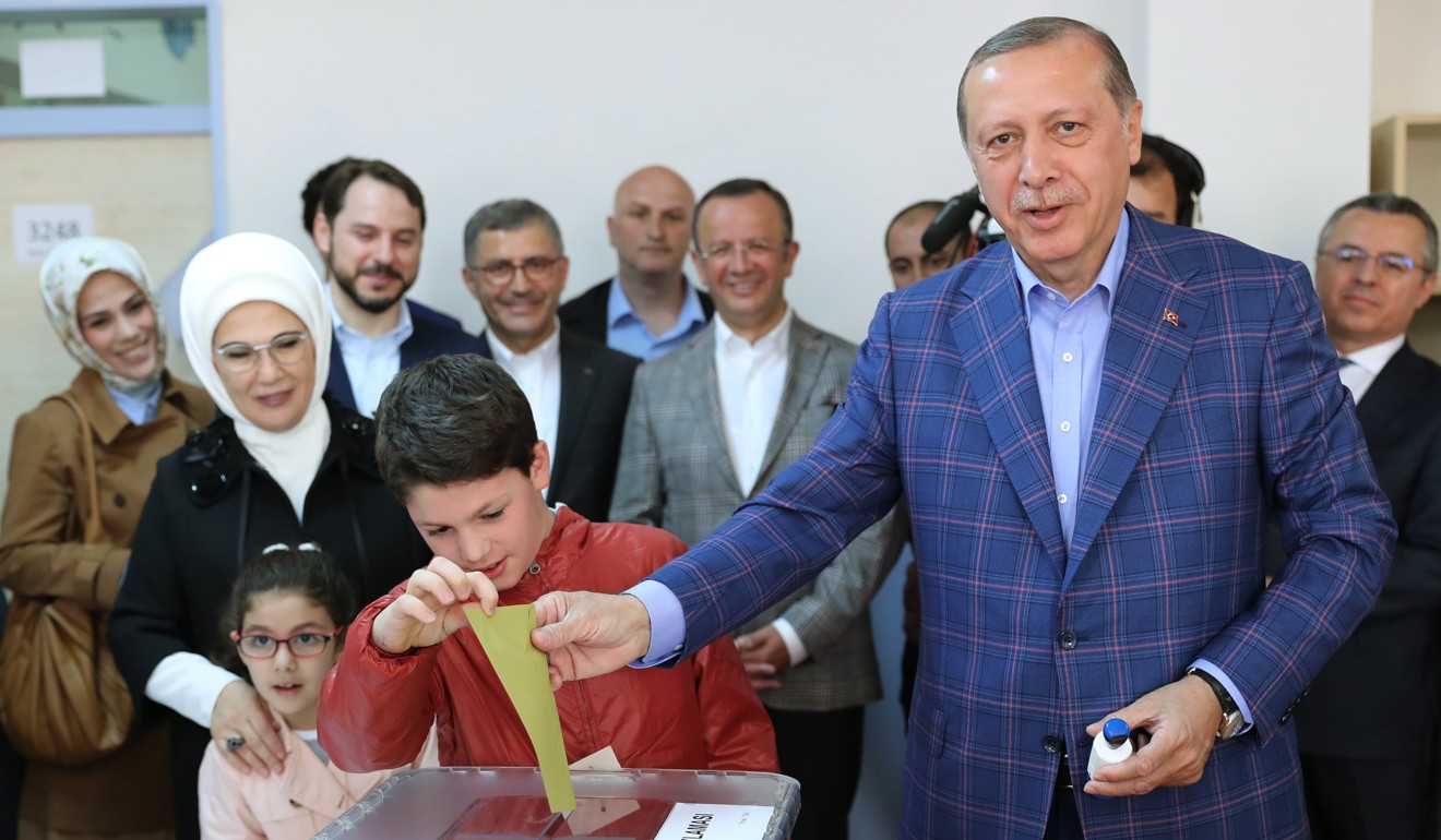 Turkish President Recep Tayyip Erdogan (right) casts his vote with his grandson Mehmet Akif in Istanbul, in April’s constitutional reform referendum. Photo: EPA