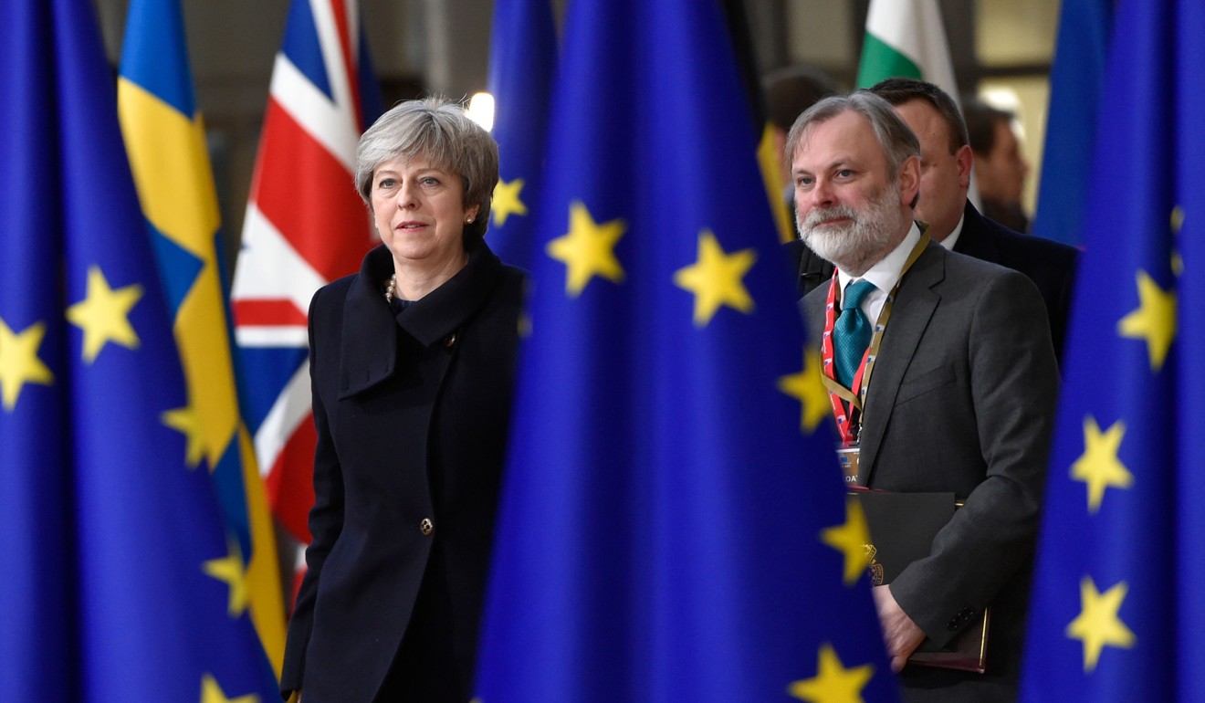 Britain's Prime Minister Theresa May and UK Permanent Representative to the EU Tim Barrow arrive to attend the first day of a European Union summit in Brussels on December 14. The meeting ended with EU leaders endorsing an interim plan for the UK’s departure, and set up another round of negotiations for March. Photo: AFP