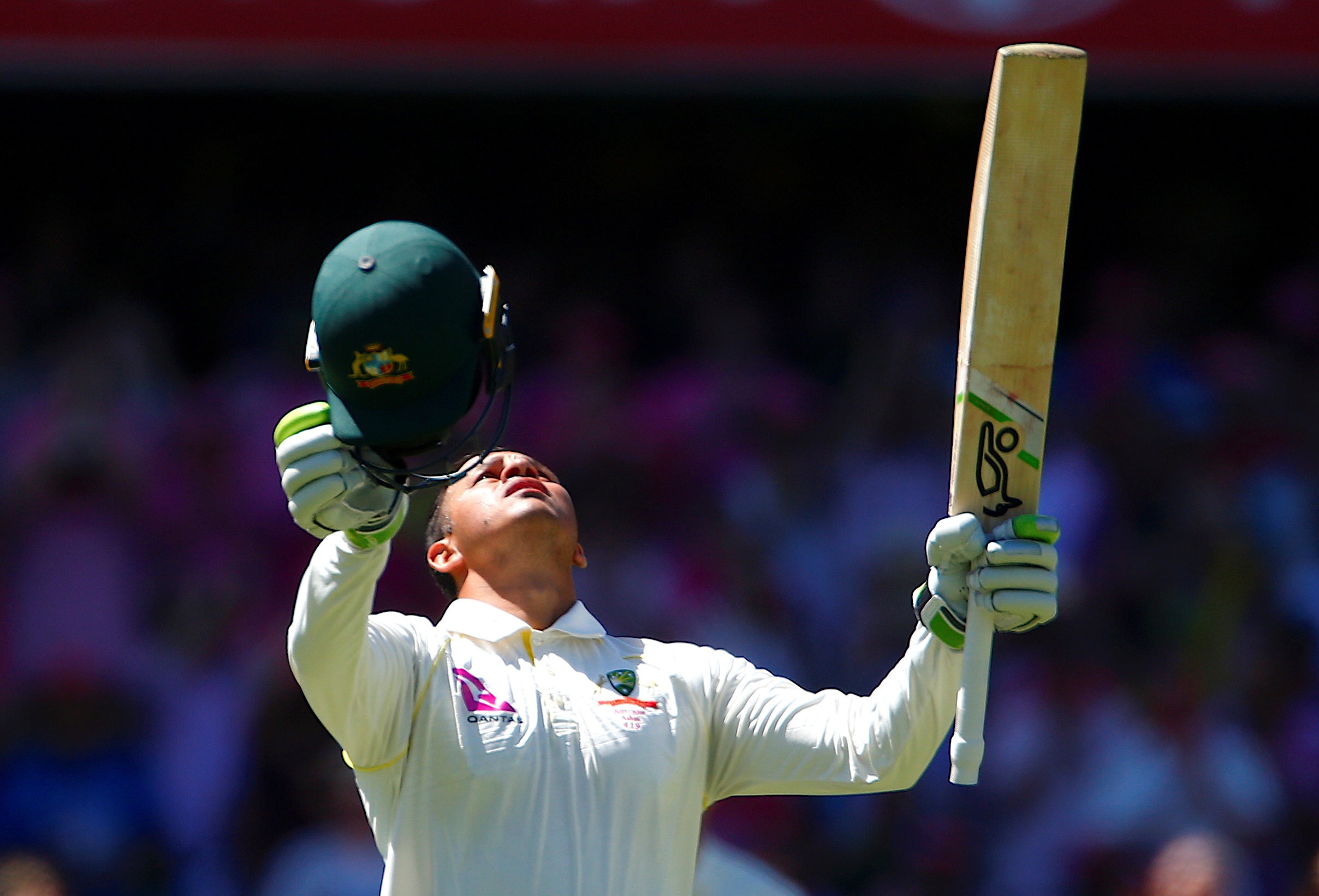 Australia's Usman Khawaja looks skyward in celebration of his first Ashes century. Photo: Reuters