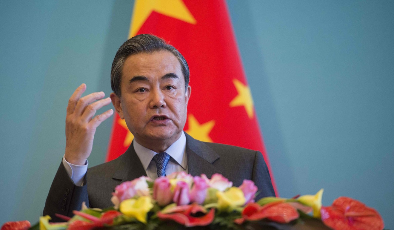 Foreign Minister Wang Yi at a press conference in Beijing on December 26. Photo: AFP