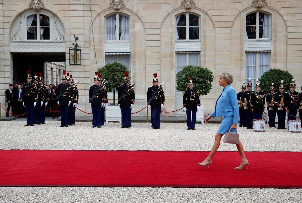 Brigitte Trogneux arrives to attend the handover ceremony between her husband, French President-elect Emmanuel Macron, and outgoing President Francois Hollande at the Elysee Palace in Paris, France, May 14, 2017. Photo: REUTERS/Christian Hartmann