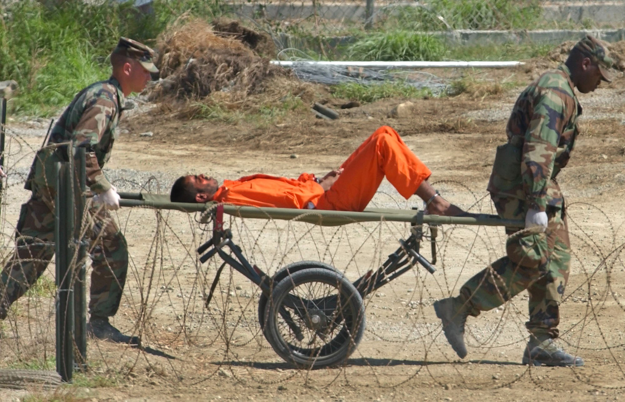 A detainee from Afghanistan is wheeled on a stretcher before being interrogated by military officials at the Guantanamo Bay US Naval Base in Cuba in 2002. Photo: AP