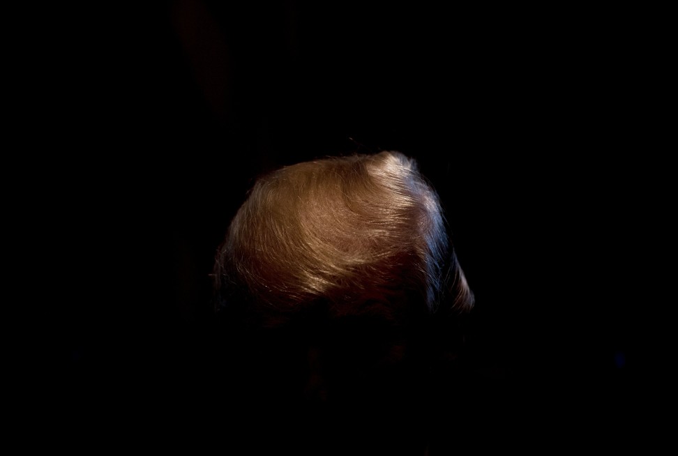 Trump’s hair – which came under fire from his own daughter Ivanka in Fire and Fury – shines as he speaks during a cabinet meeting at the White House earlier this month. Photo: AFP