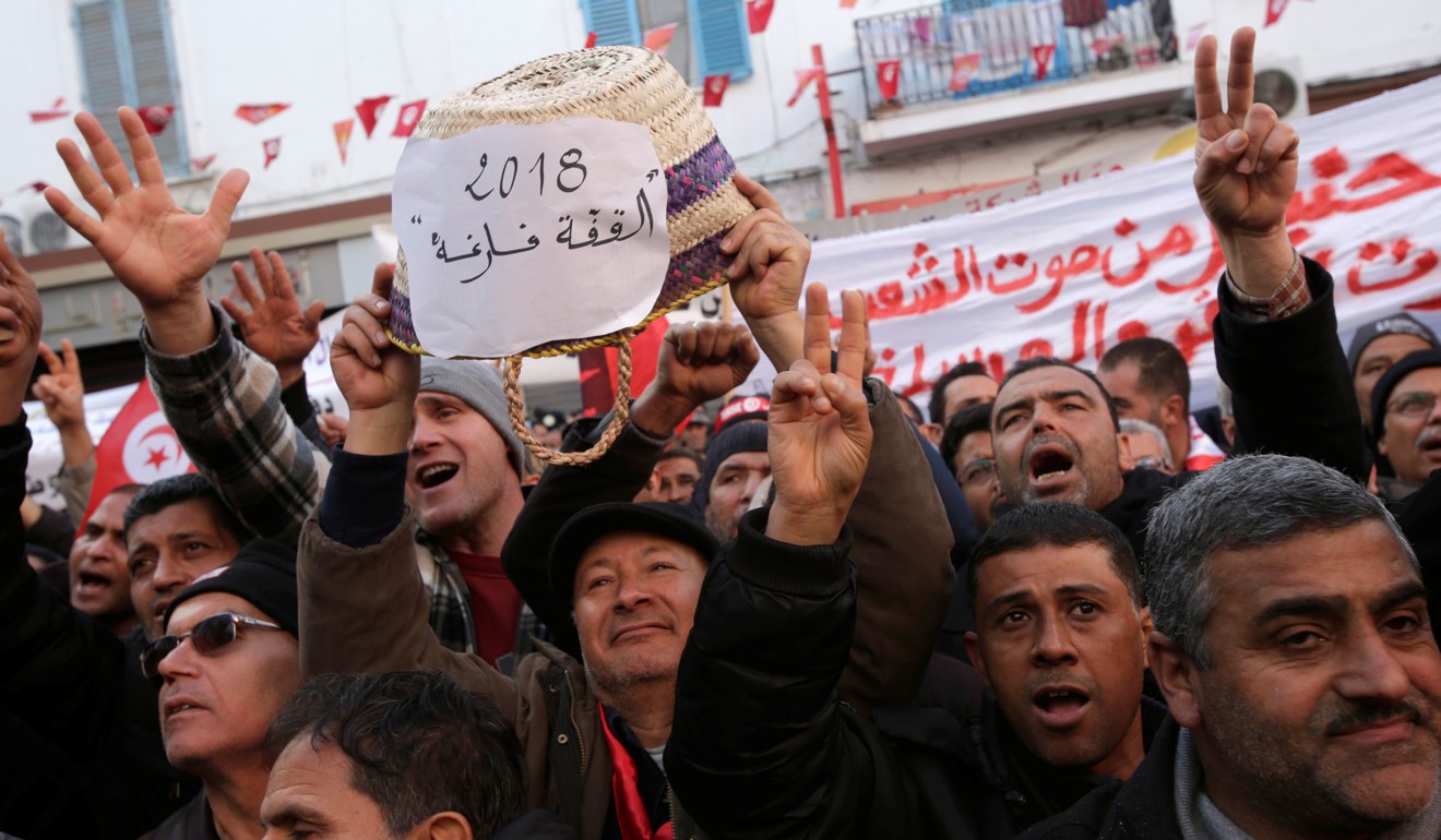 People at a demonstration on the seventh anniversary of the toppling of former Tunisian president Zine El-Abidine Ben Ali, in Tunis. Photo: Reuters