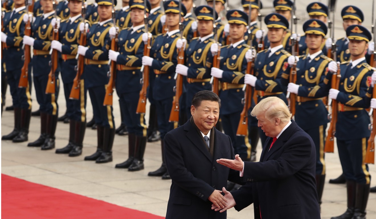 Presidents Donald Trump and Xi Jinping take part in a welcoming ceremony at the Great Hall of the People in Beijing on November 7, 2017. Trump set off alarm bells in China in late 2016 by speaking to Taiwan’s president by phone, but behaved less provocatively during his first year in office as he sought China’s help in reining in North Korea’s nuclear programme. Photo: AP