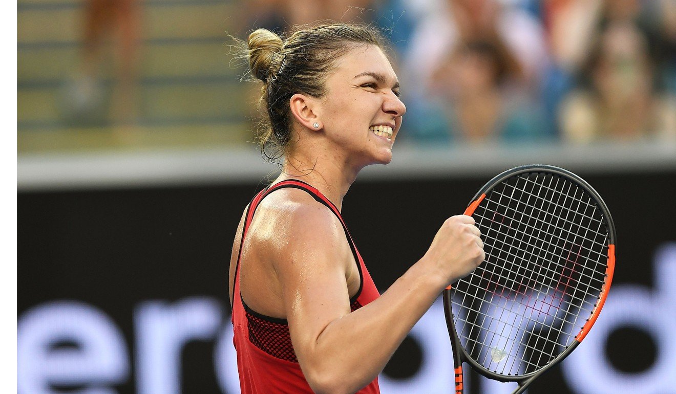 Simona Halep of Romania celebrates after winning her second-round match against Eugenie Bouchard of Canada. Photo: EPA