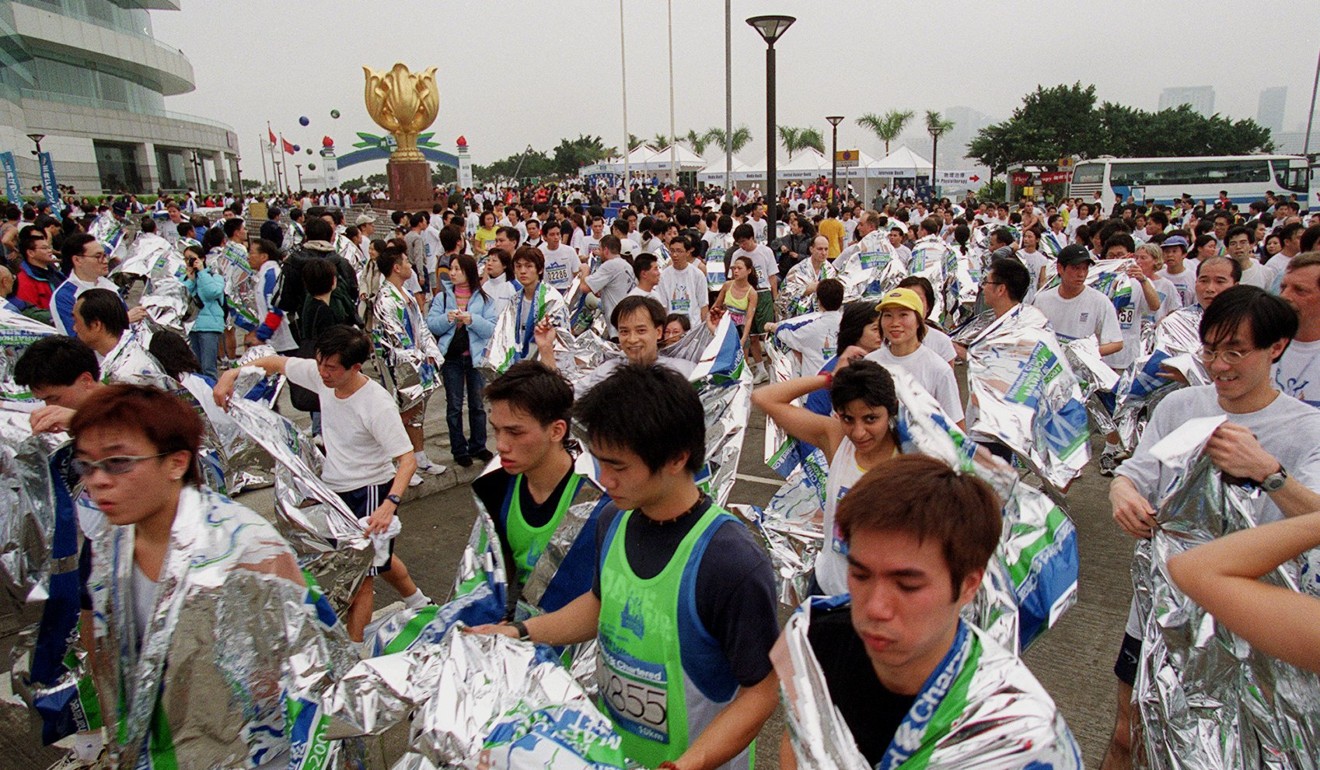 Runners are given heat blankets by the organisers after finishing the 2001 Standard Chartered Hong Kong Marathon. Photo: David Wong