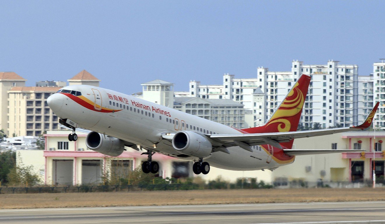Hainan Airlines and China Eastern Airlines have lifted the ban, and Spring Airlines will also allow phones to be used in flight mode from next month. Photo: Reuters