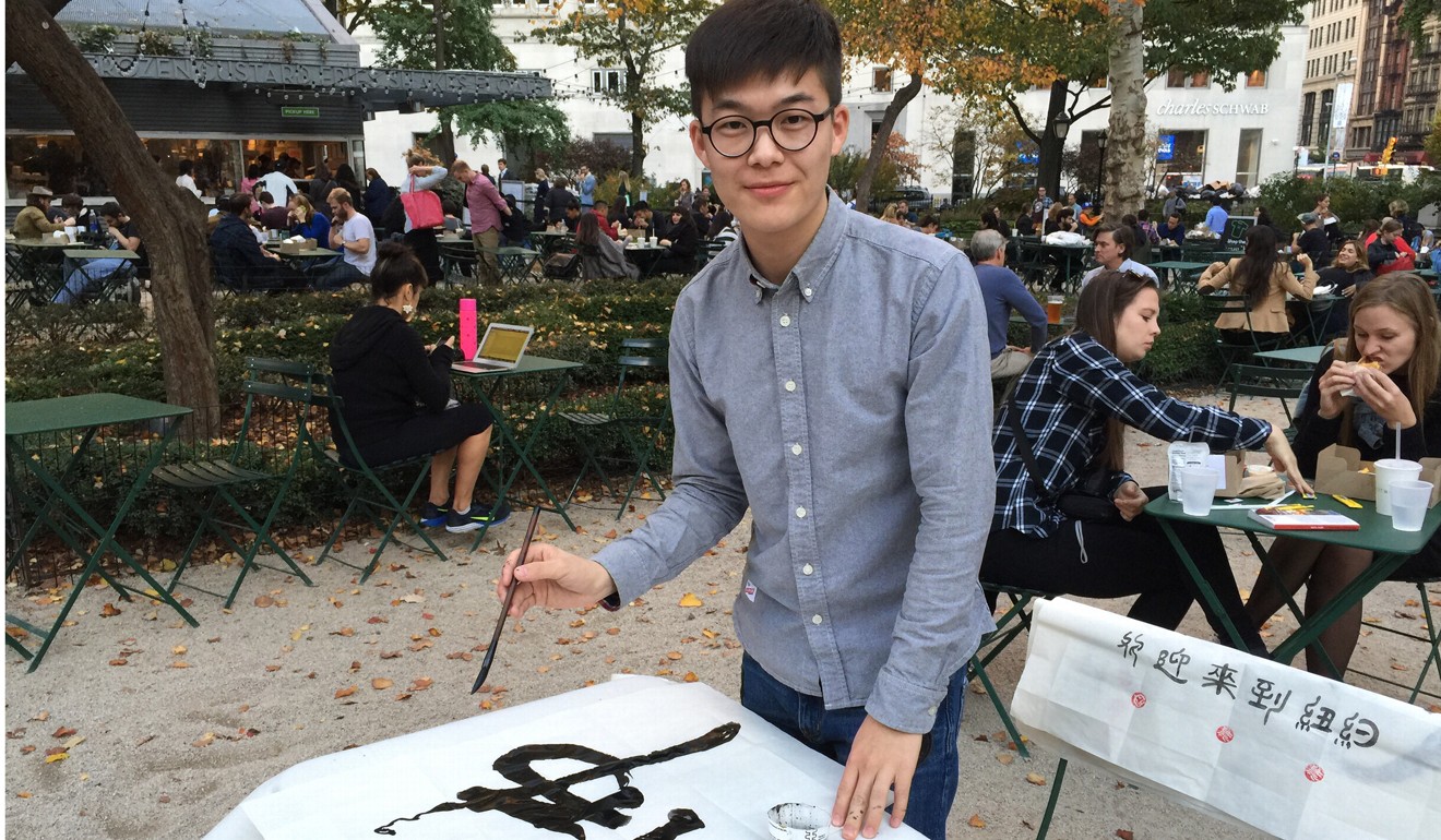 Deng Linjie paid back the social media users who lent him money for his education partly by working as an outdoor vendor of Chinese calligraphy. Photo: SCMP Pictures