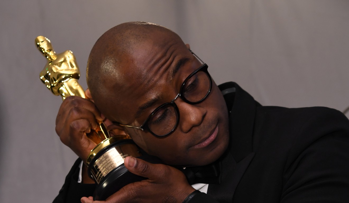 Jenkins cradles his award after the Oscars last year. File photo: AFP