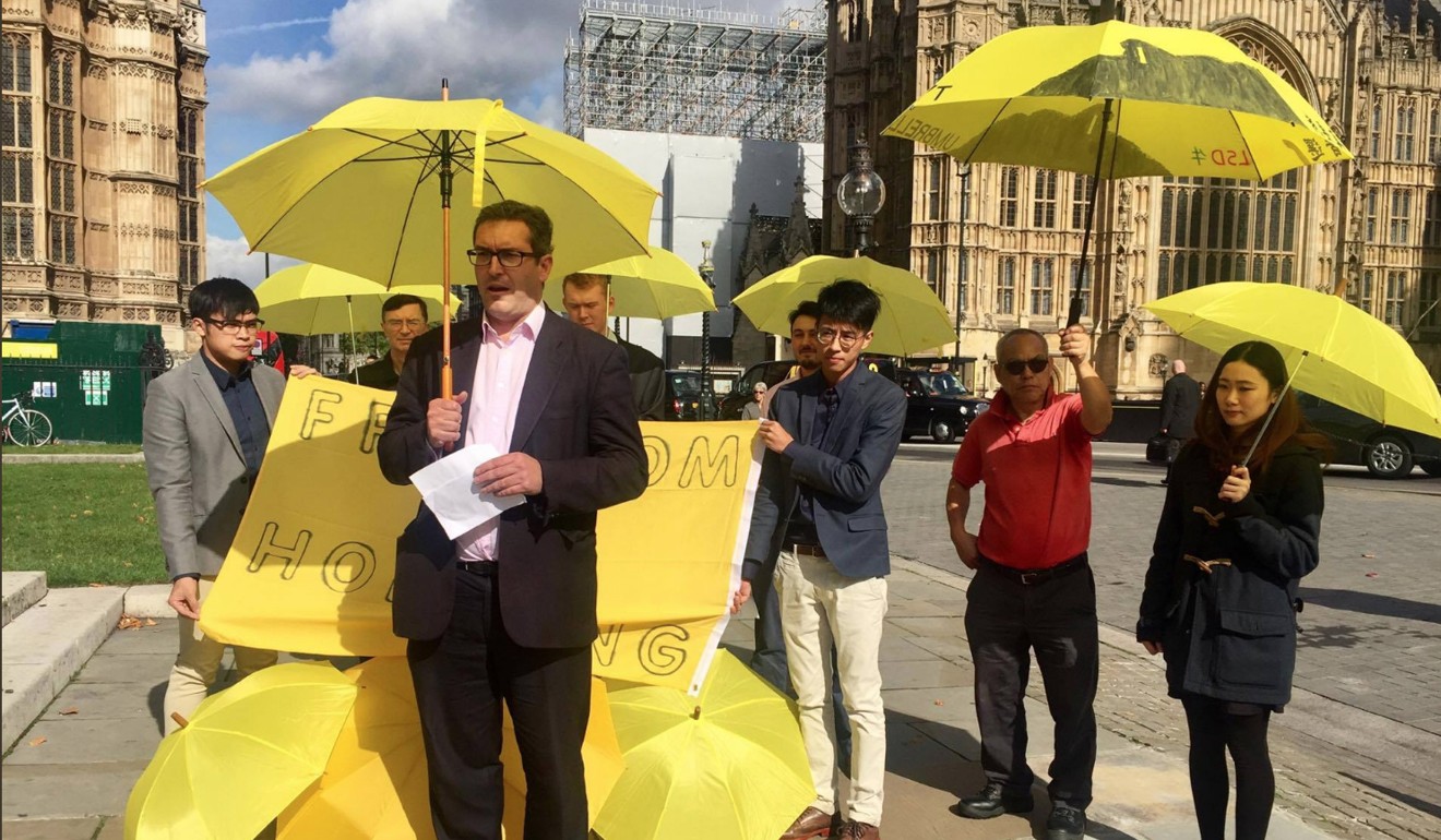 Benedict Rogers (centre) speaks in a demonstration for Hong Kong democracy outside Parliament House in London in September 2017. Rogers is the co-founder and chair of Hong Kong Watch, which released the recent report by Paddy Ashdown. Source: Benedict Rogers / Twitter