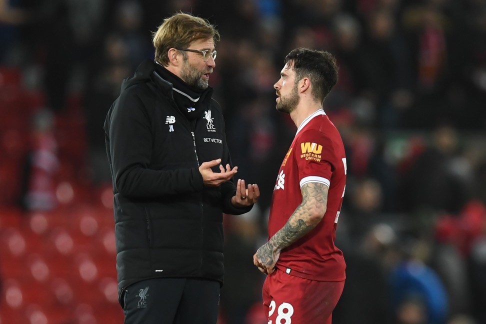 Juergen Klopp speaks with Liverpool’s Danny Ings. Photo: AFP