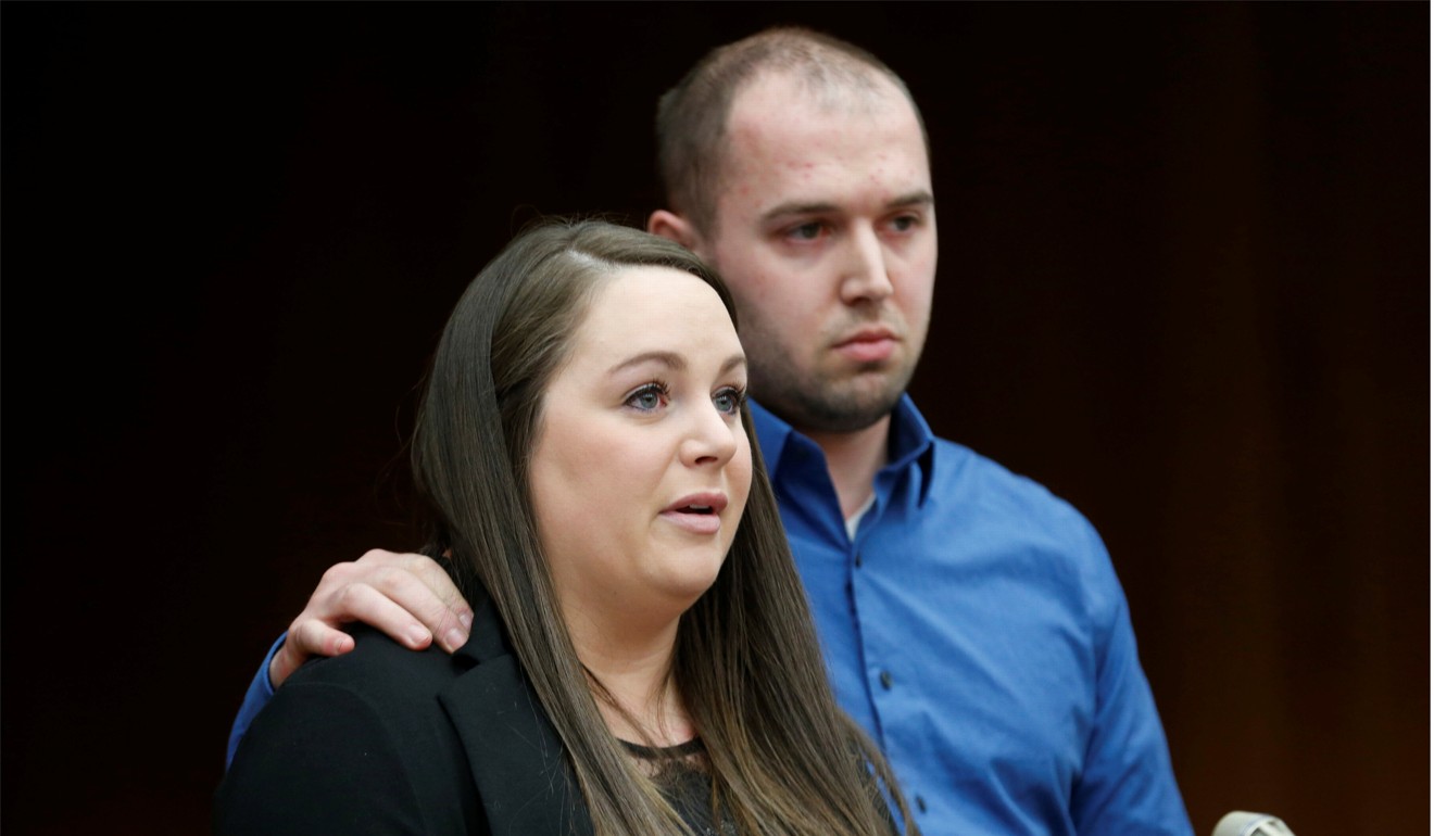 Tiffany Dutton reads her victim impact statement as her husband Chad stands next to her on Wednesday. Photo: Reuters
